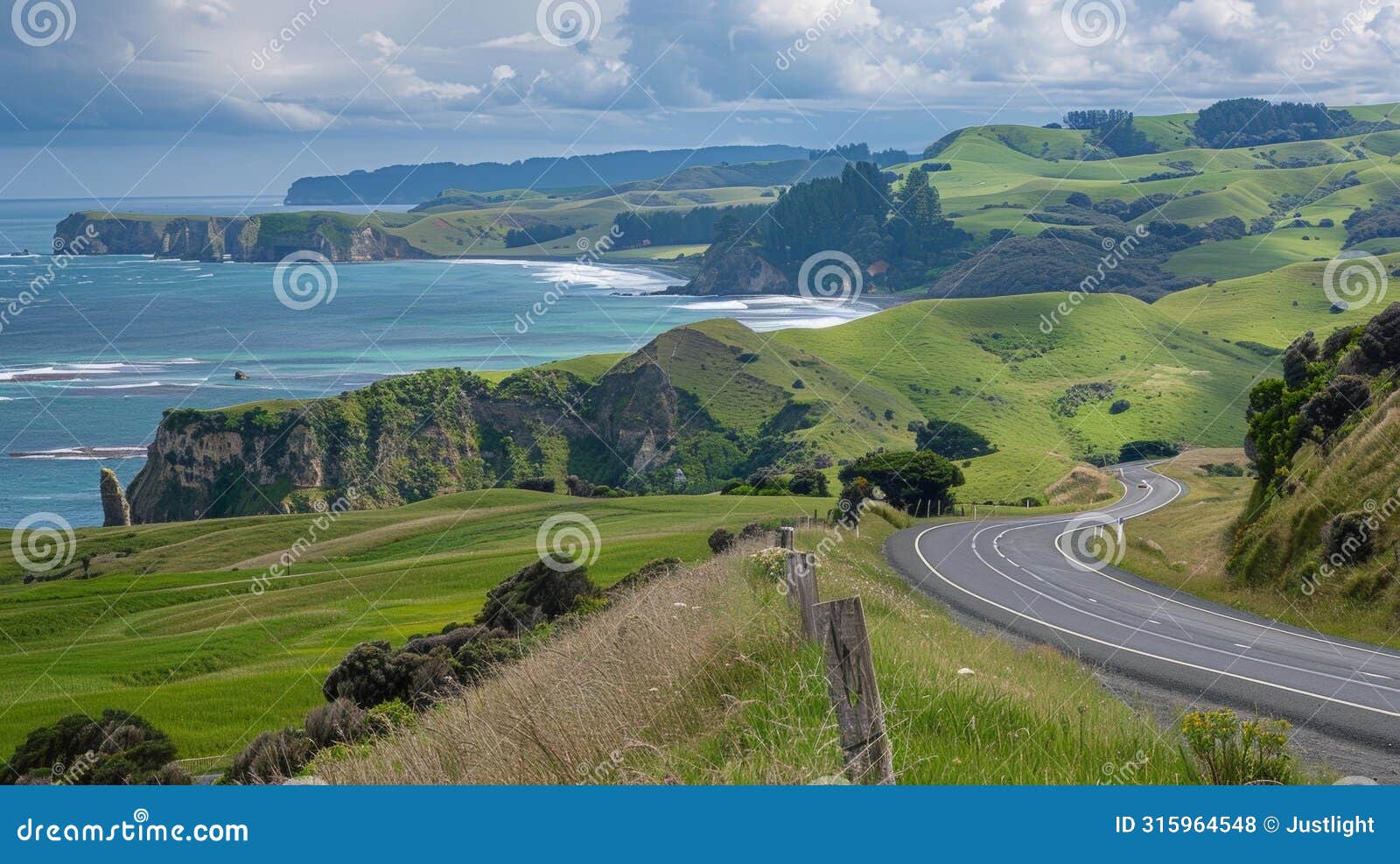 the panoramic view from the road is a patchwork of earth sea and sky. verdant hillsides give way to dramatic cliffs