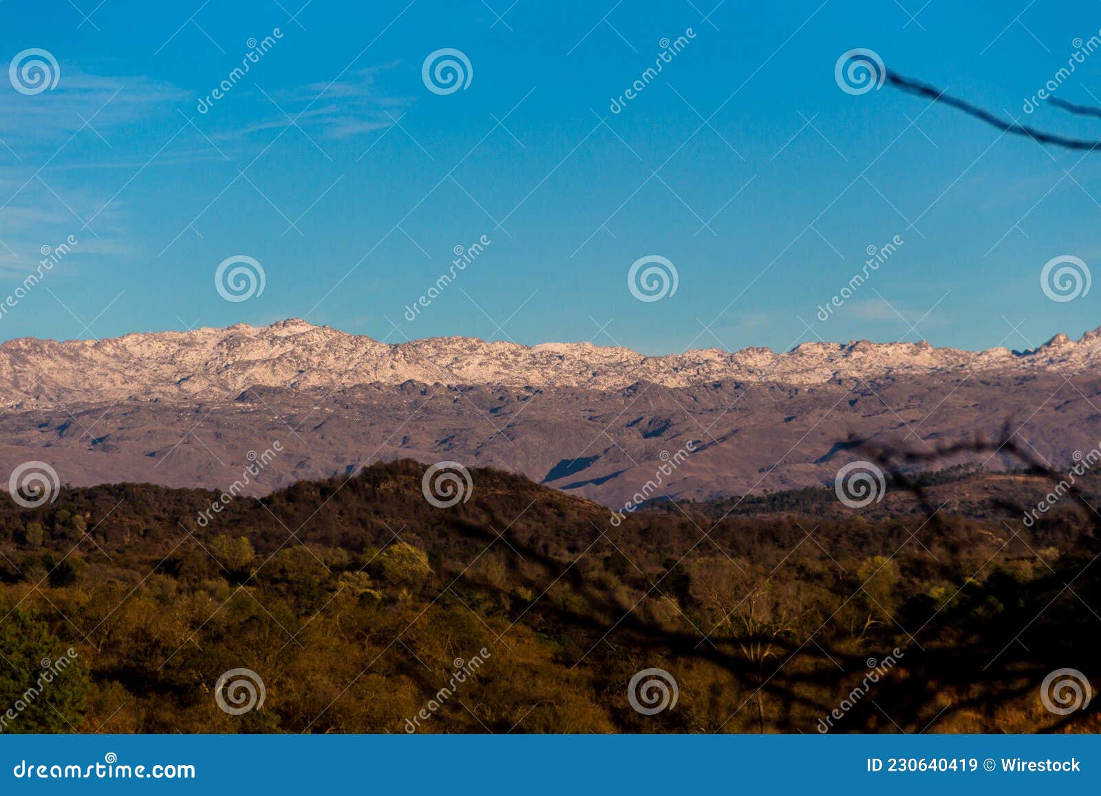 panoramic view of the snowy mountain ranges in the calamuchita valley, cordoba, argentina