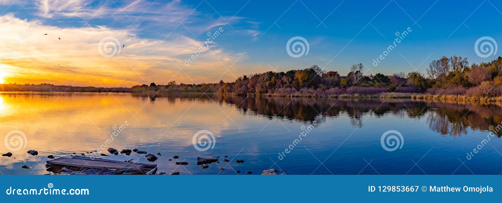 panoramic view of sunset with beautiful skyline over ed zorinsky lake omaha nebraska