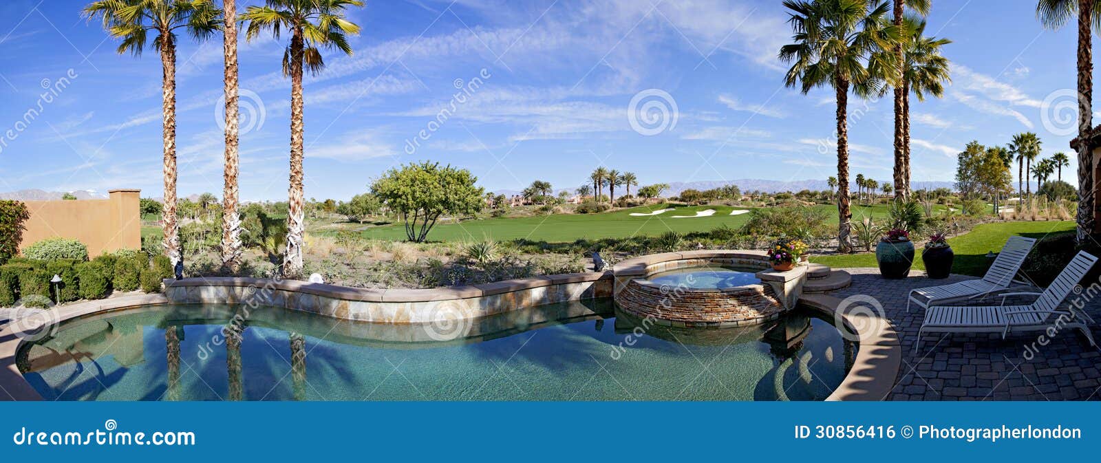 panoramic view of swimming pool, hot tub and golf course