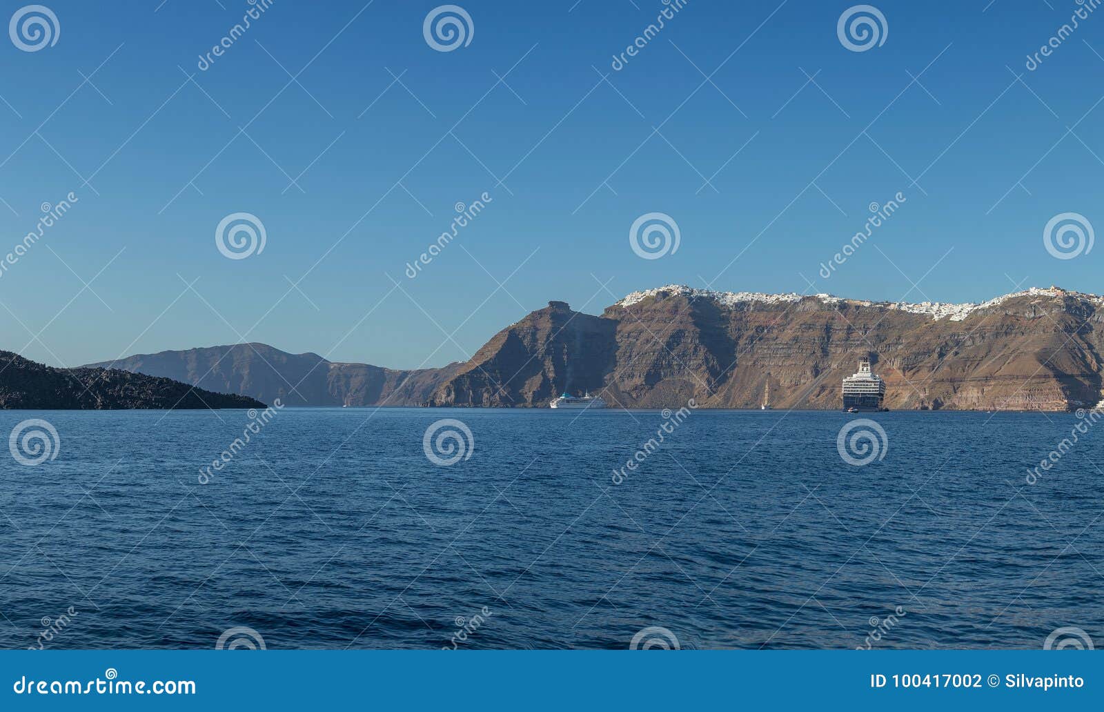 panoramica of fira, santorini view of the sea with cruises.
