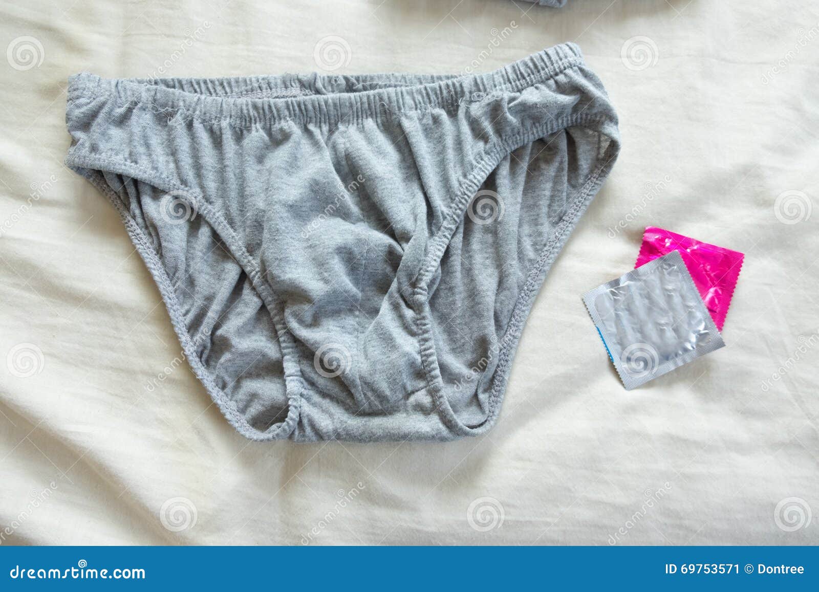 Panties and a condom stock image. Image of young, contraceptive 69753571