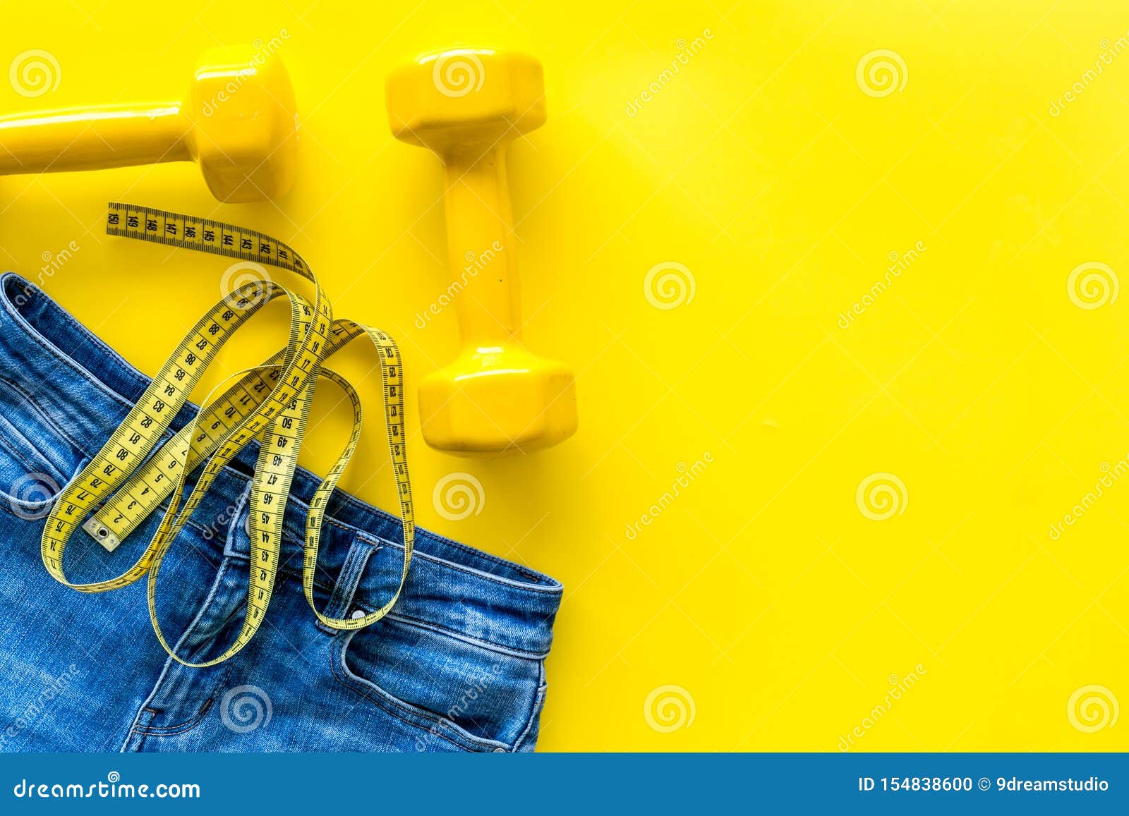 Download Pants Bars And Measuring Tape For Weight Loss On Yellow Background Top View Mockup Stock Photo Image Of Loose Mockup 154838600