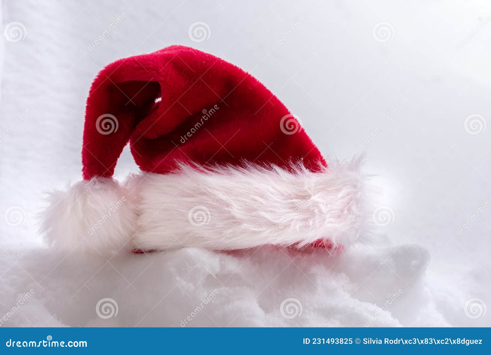 papa noel`s hat on snow background