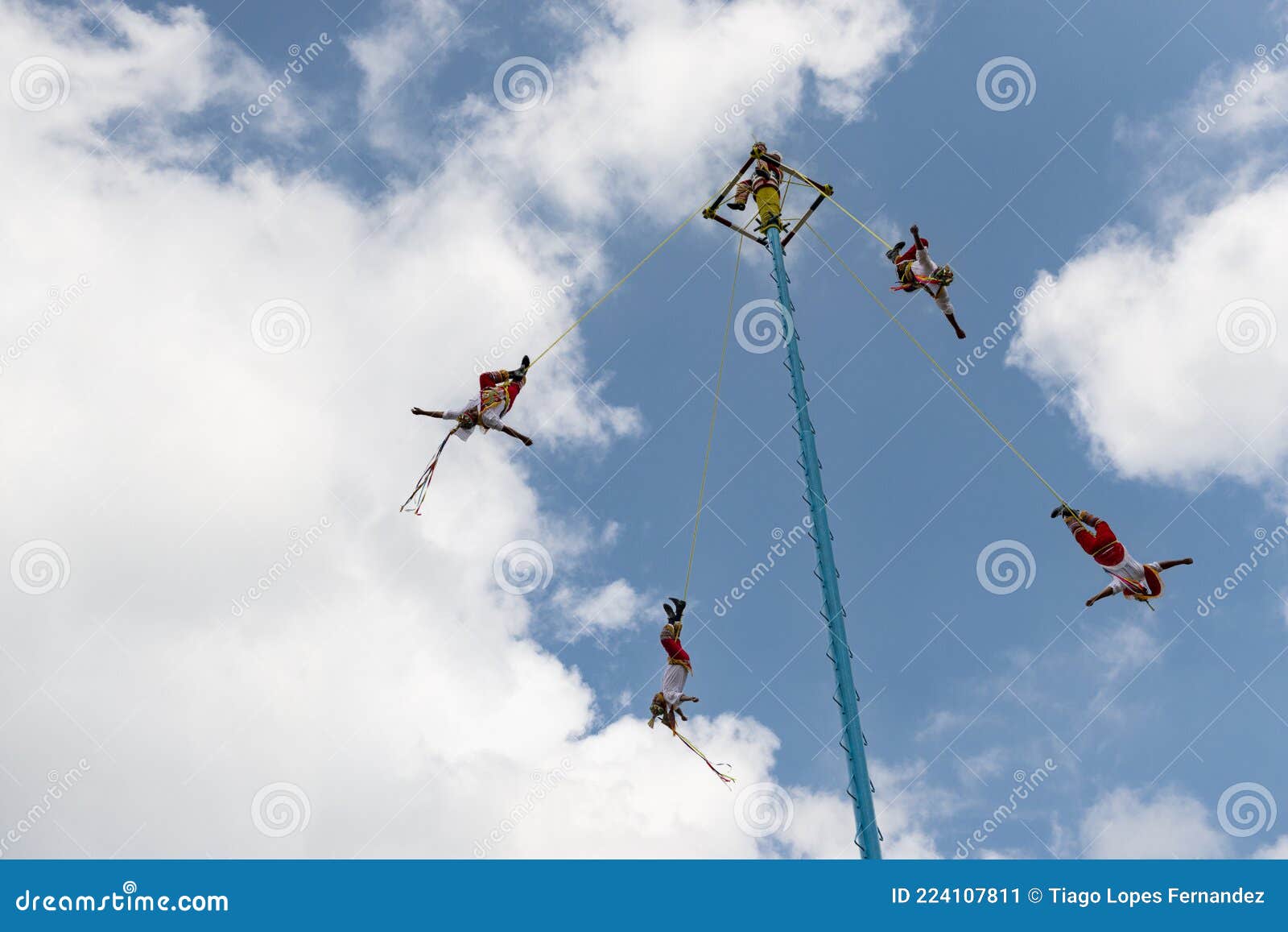 A Group of Voladores Flyers Climbing the Pole To Perform the
