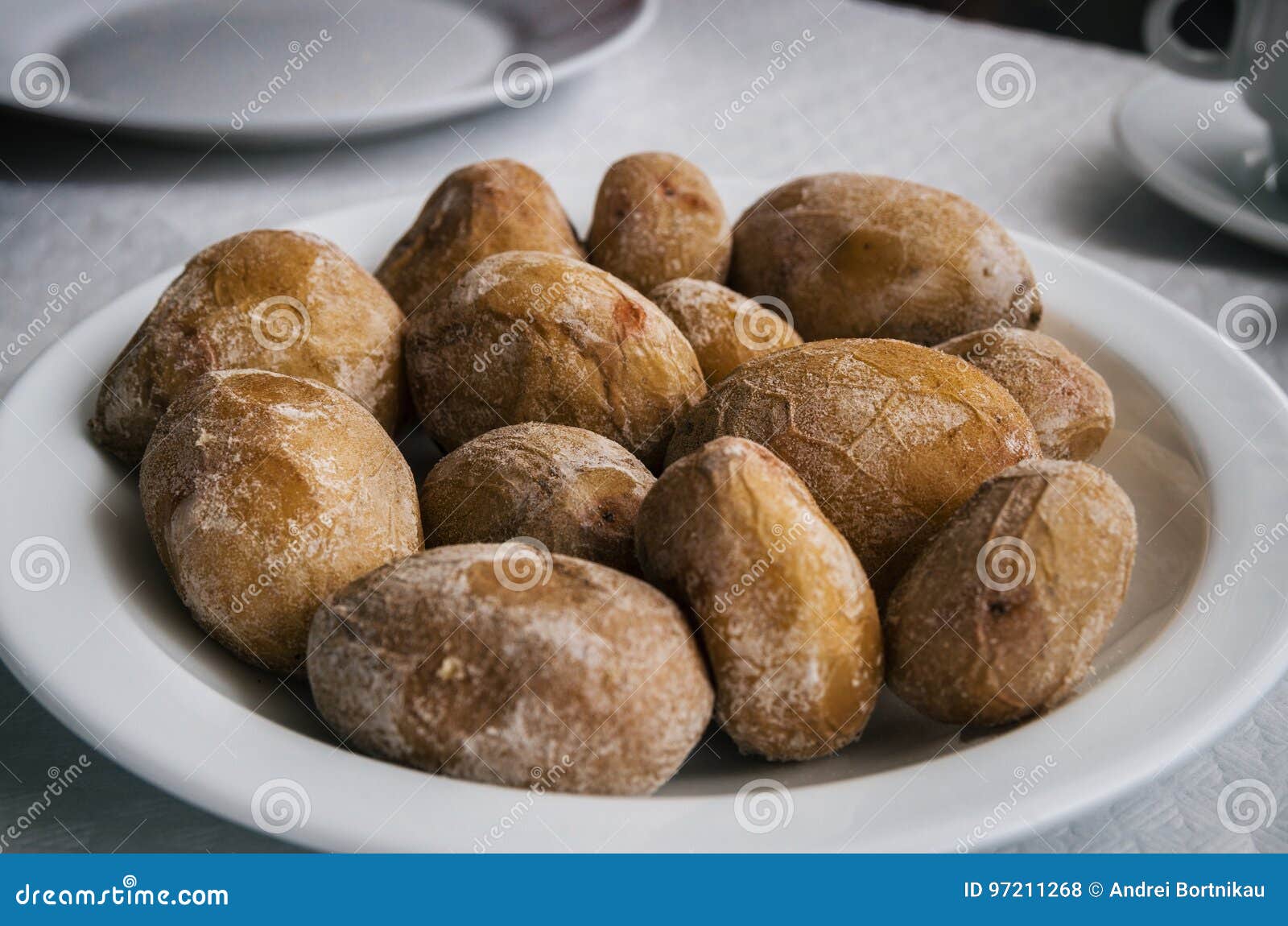 papas arrugadas - small canarian potatoes with salt on a plate close up