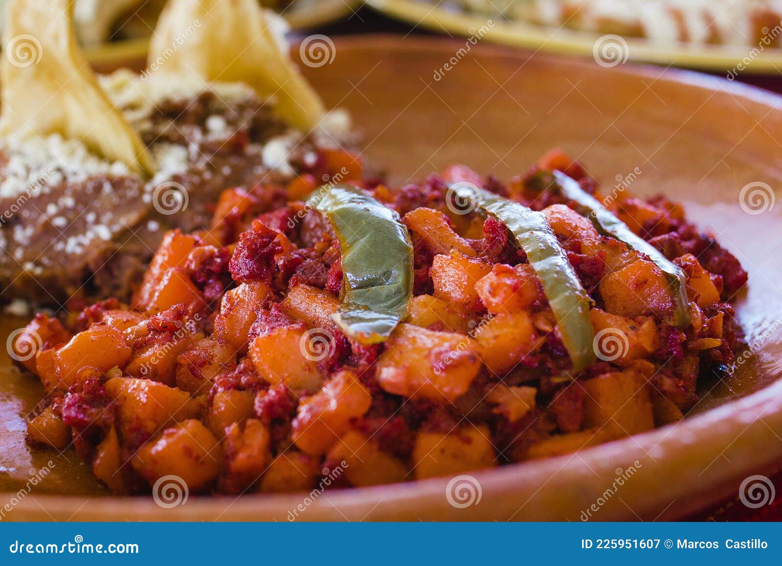 papas with chorizo or potatoes with chorizo and refried beans, mexican food in mexico city