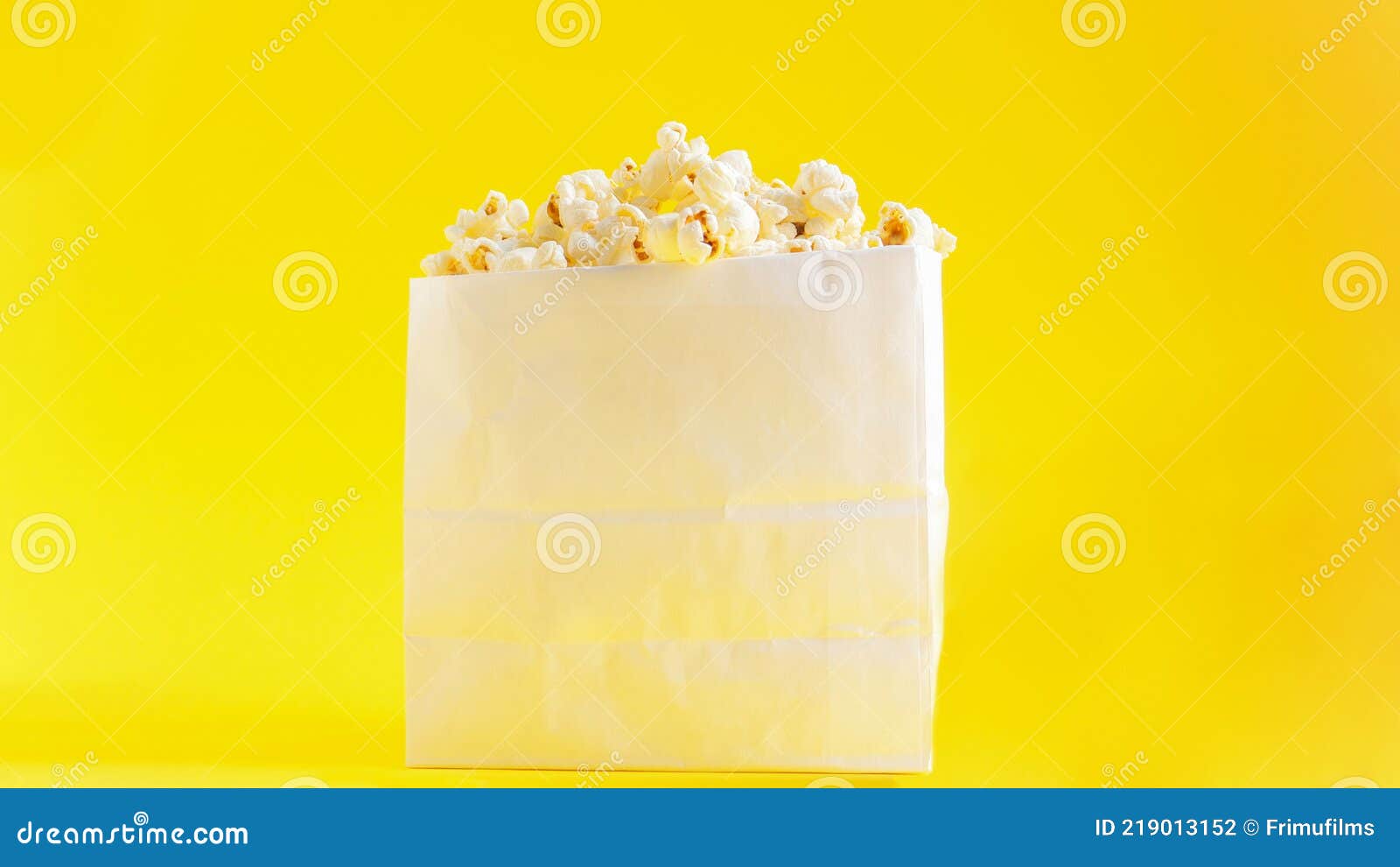 A paper bag of popcorn stock photo. Image of heap, container 219013152