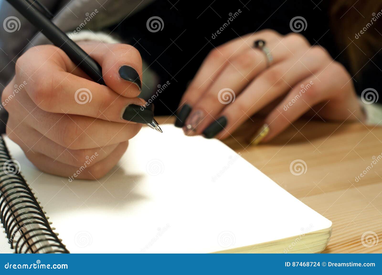 Paper in Business Woman Female Hand Writing Notes on a Table Black ...