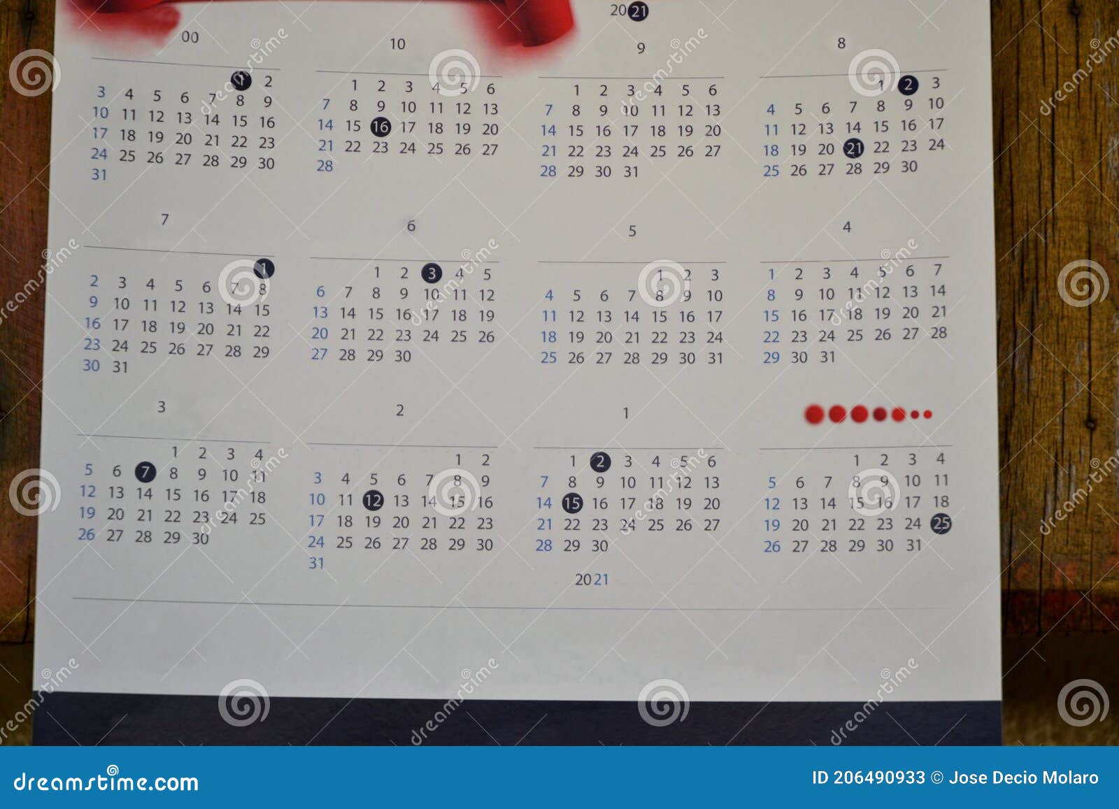 paper calendar with the year 2021 the final year on wooden background