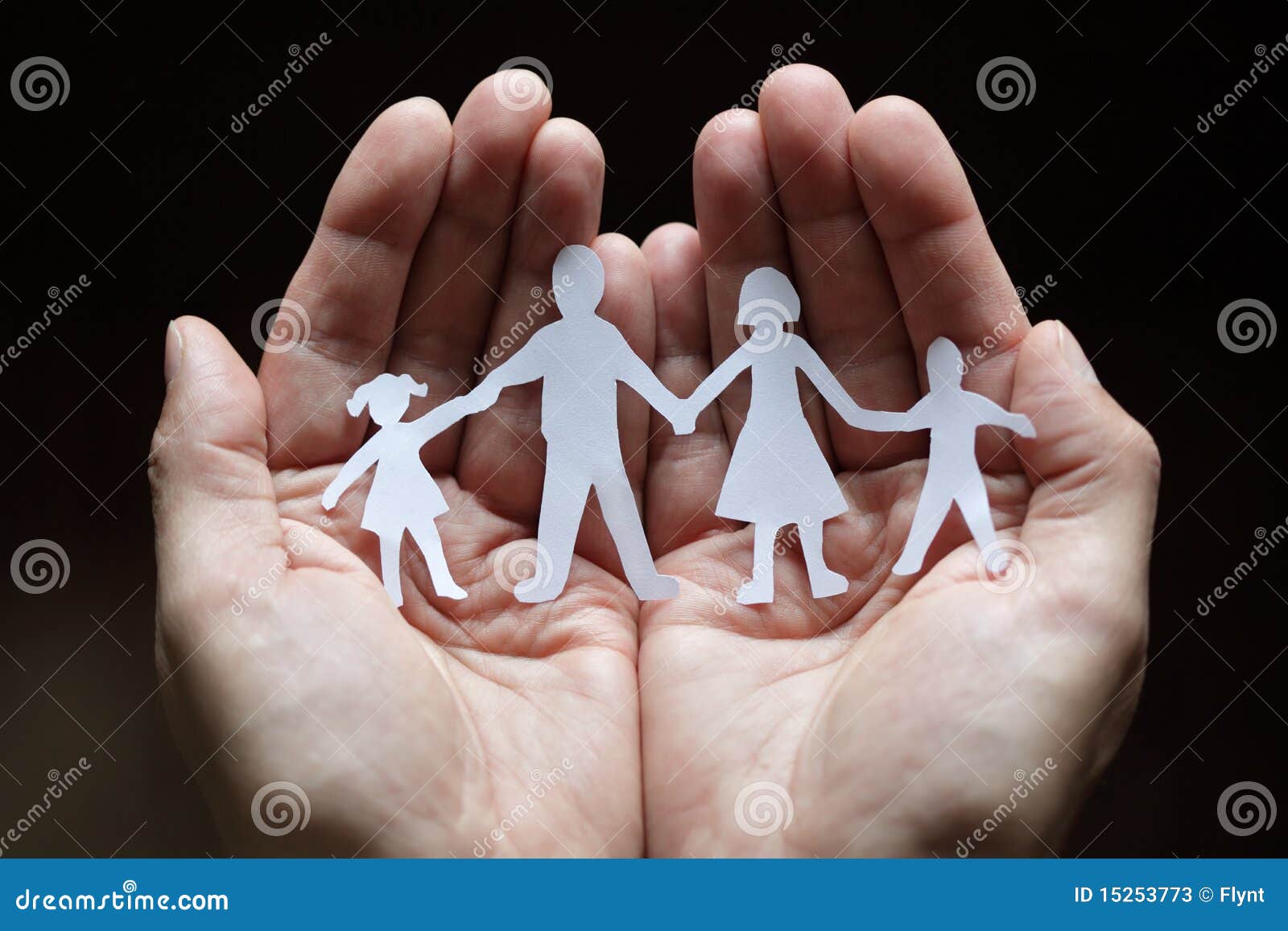 paper chain family protected in cupped hands