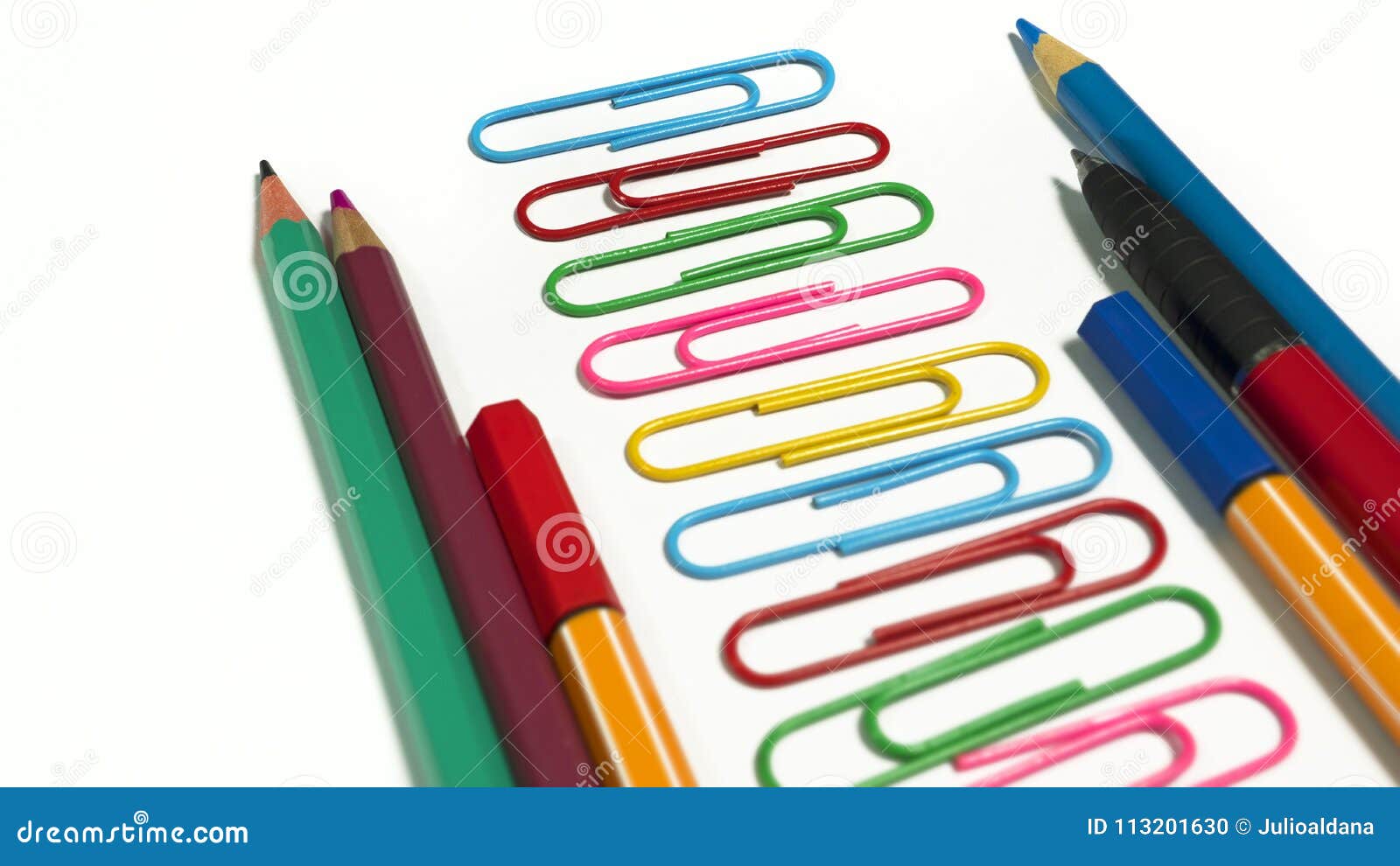 Paper Clips, Colored Pencils and Pens Placed in Sequence Stock Photo Image of colorful, green