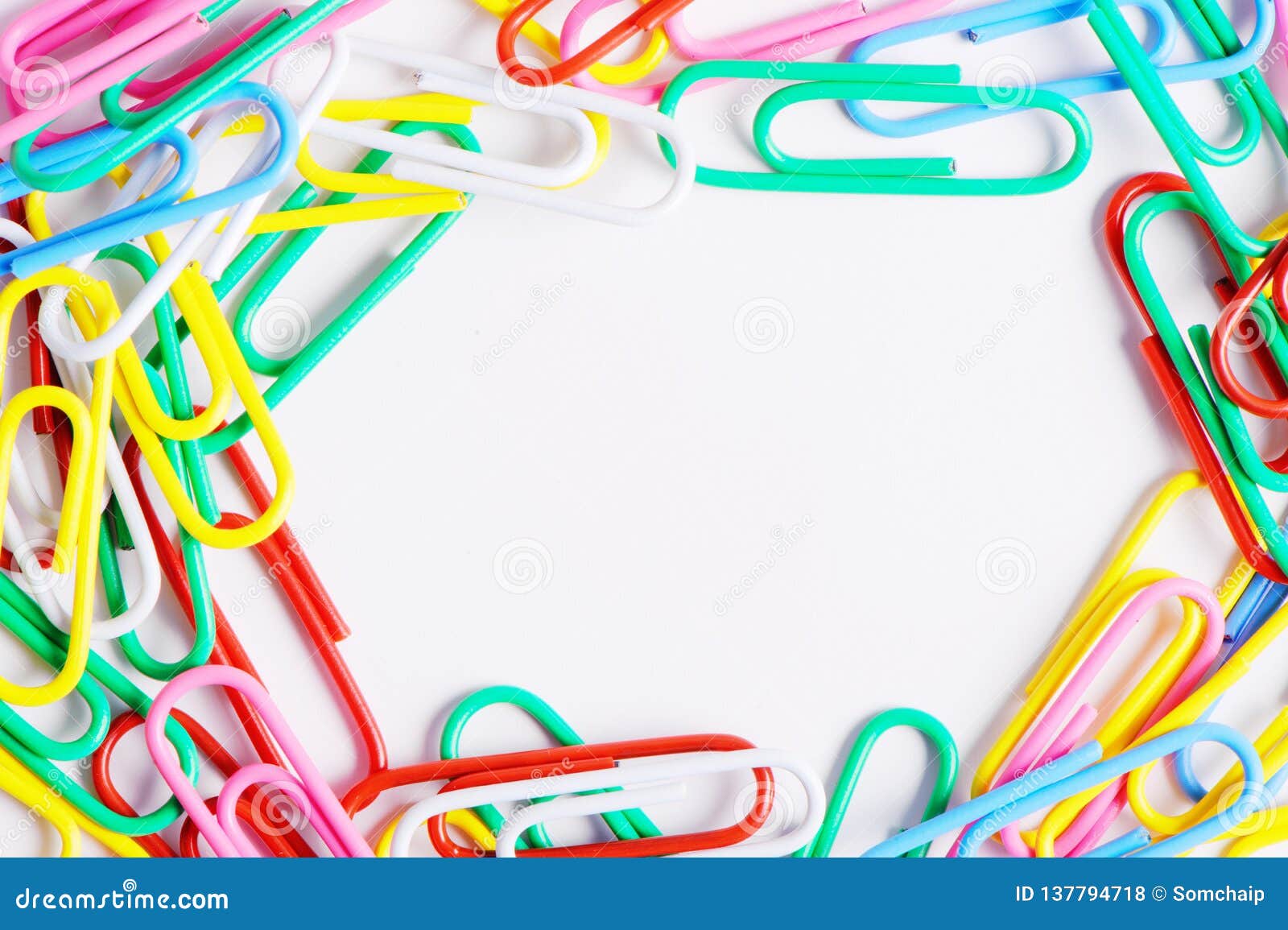 Paper Clips and Crayons from the White Background Stock Photo Image