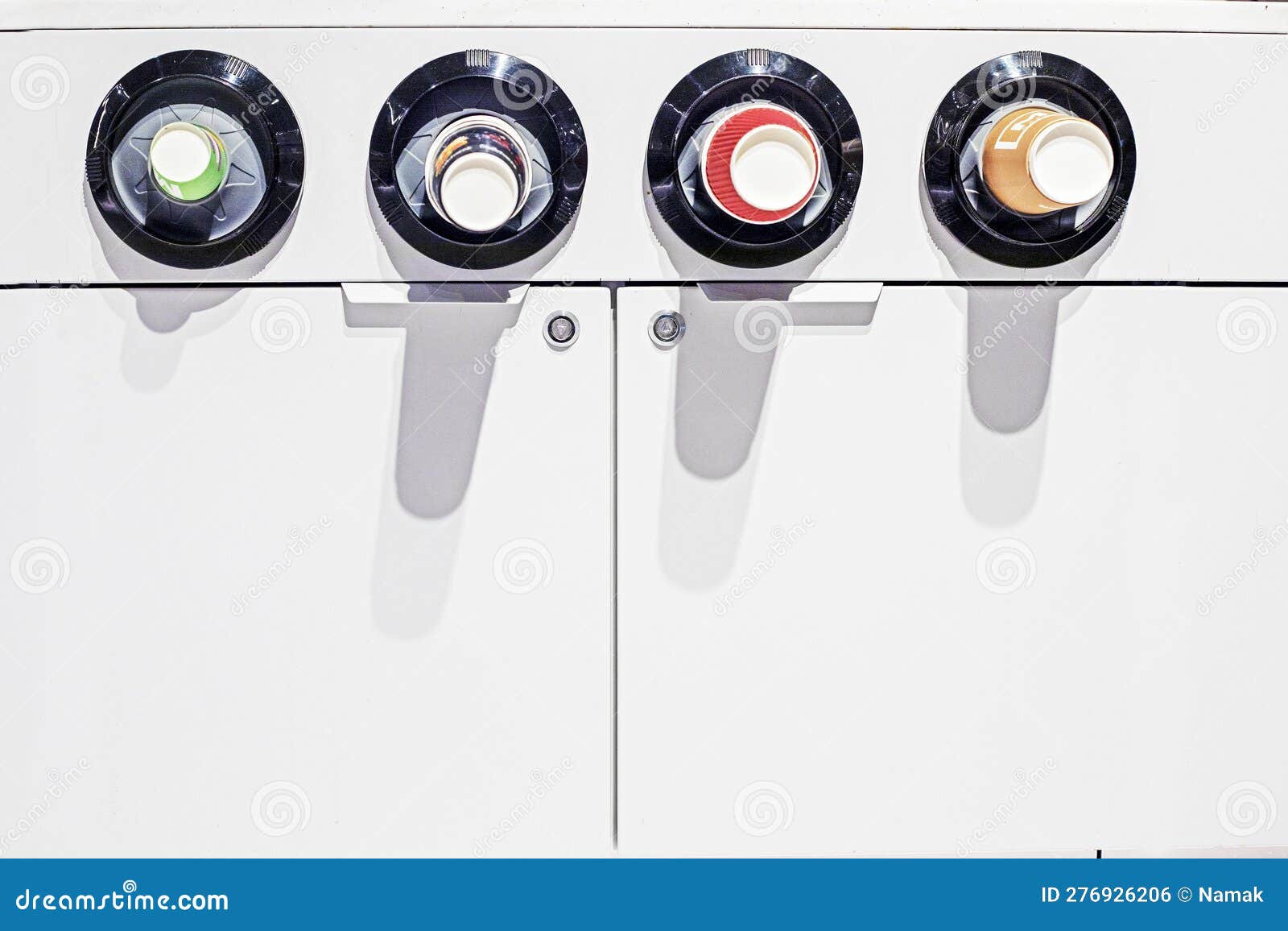 Paper Cups in a Vending Machine with Various Drinks. Stock Photo
