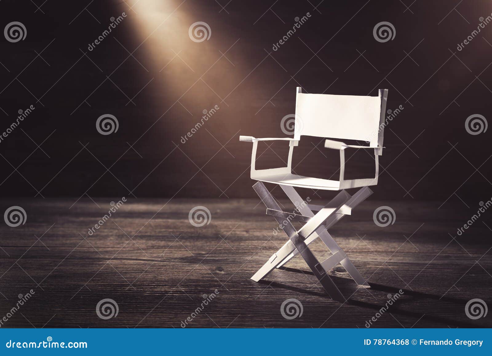 paper director chair on a blueish grey background