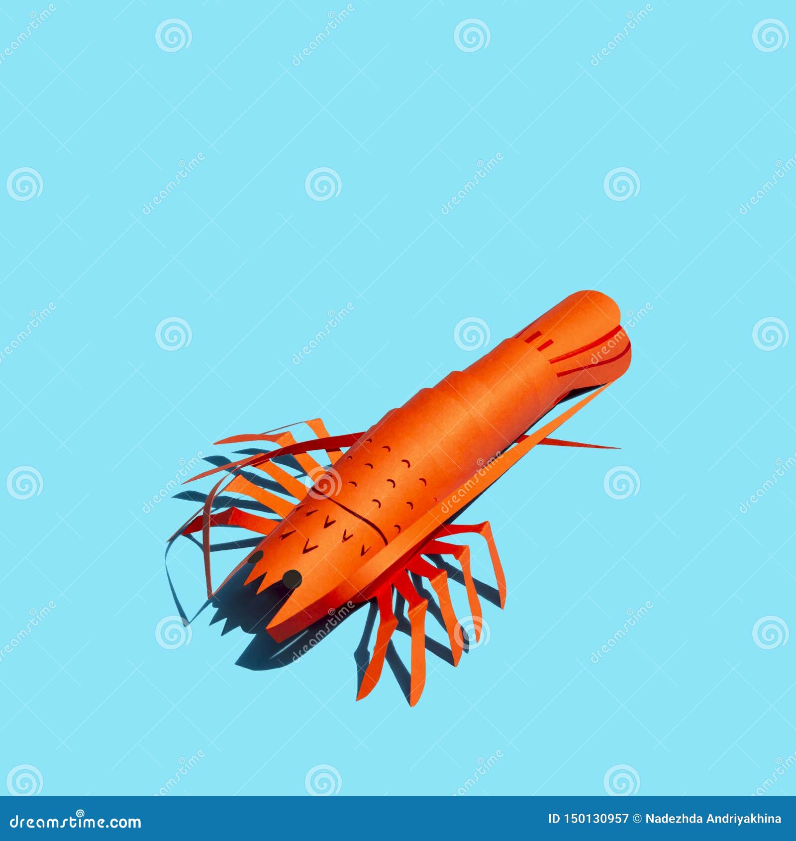 paper lobster with shade in bright sunshine