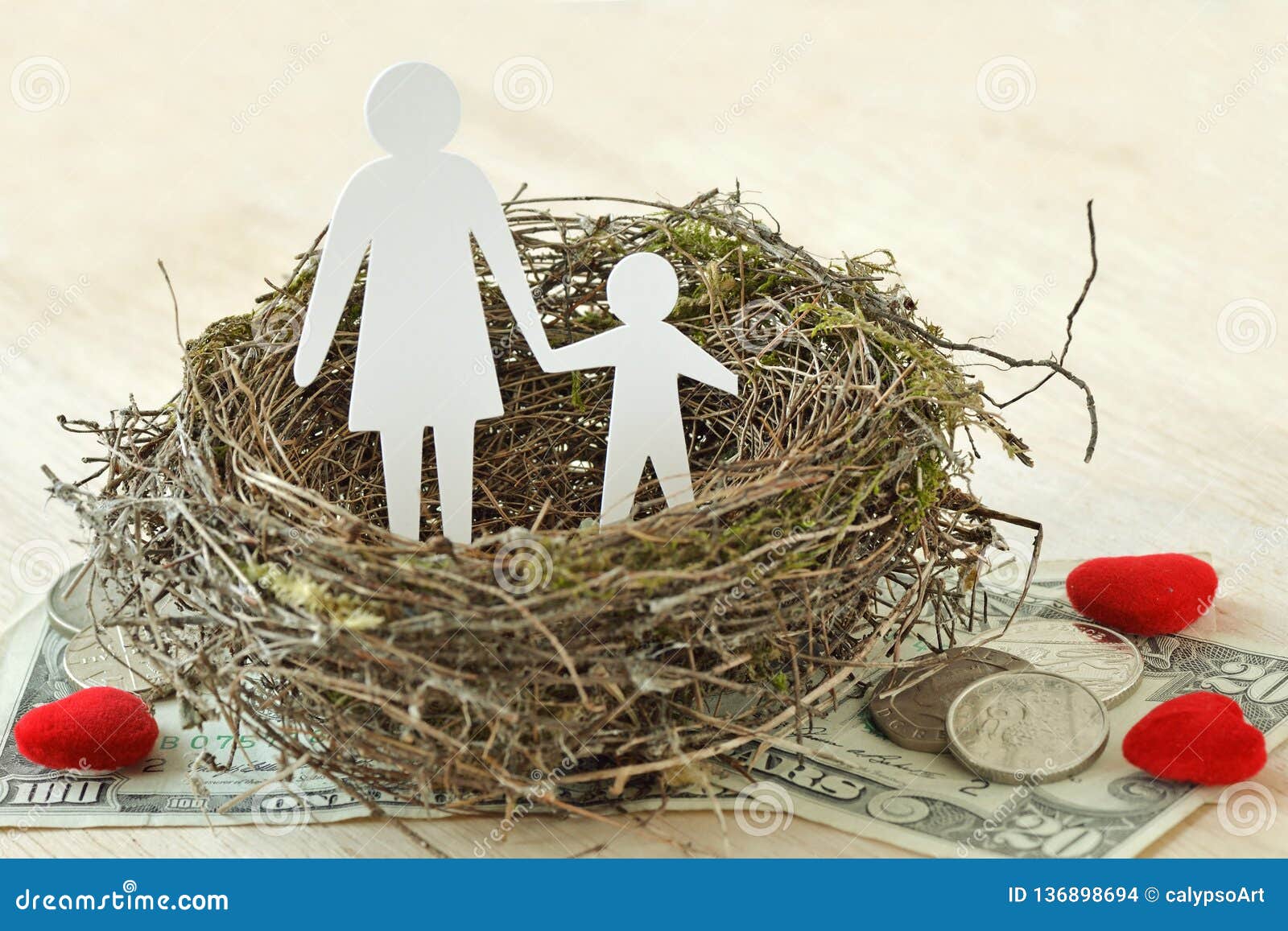 paper mother and son in nest on money and hearts - concept of single parent family