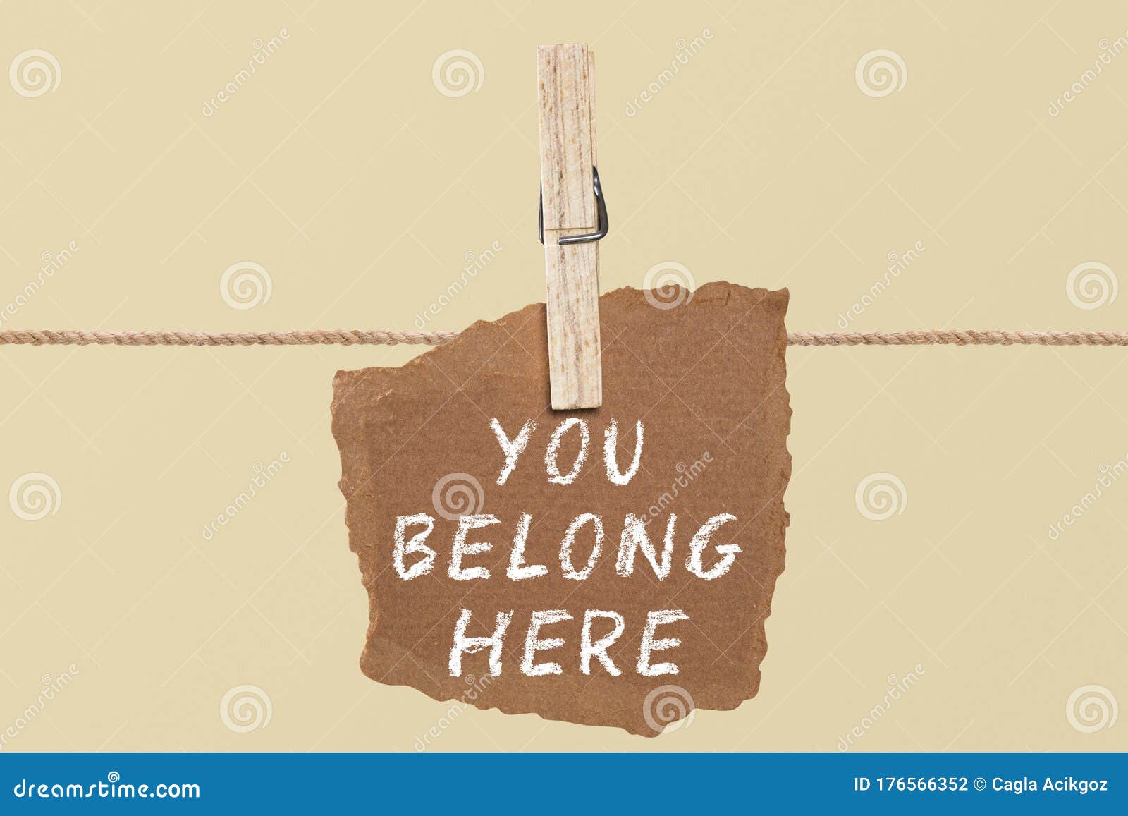 you belong here    a paper on the pegs. and this is the word written
