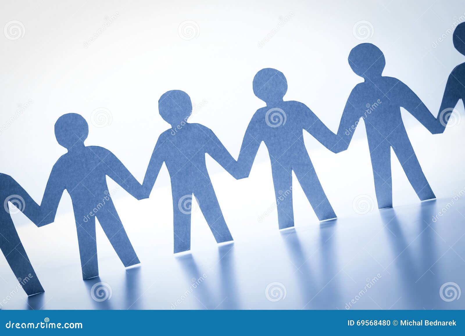 paper people standing together hand in hand. team, society, business concept