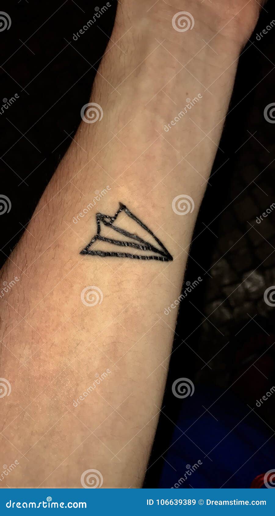 Minimalist airplane tattoo on the wrist