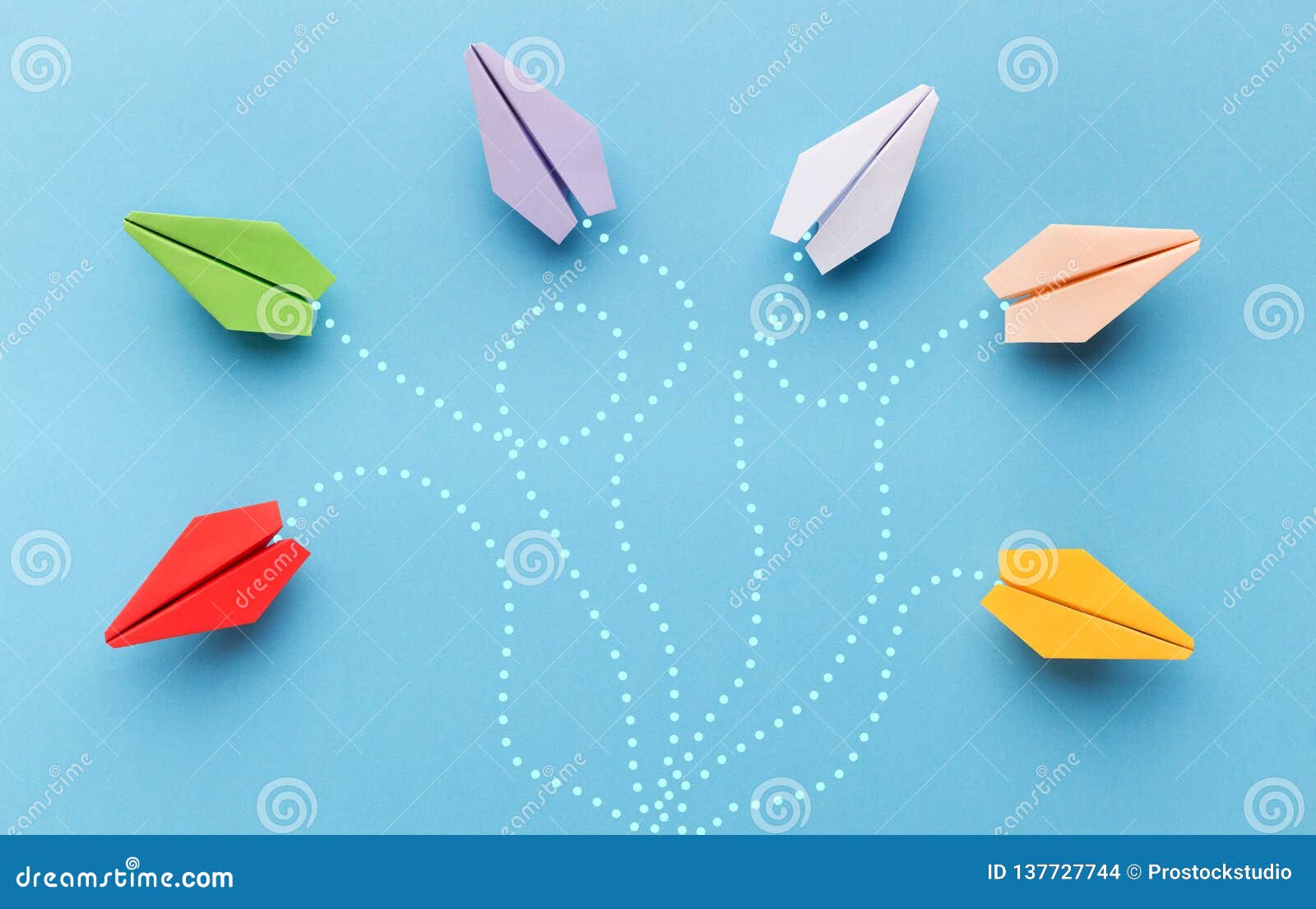 paper planes with route trace on blue background