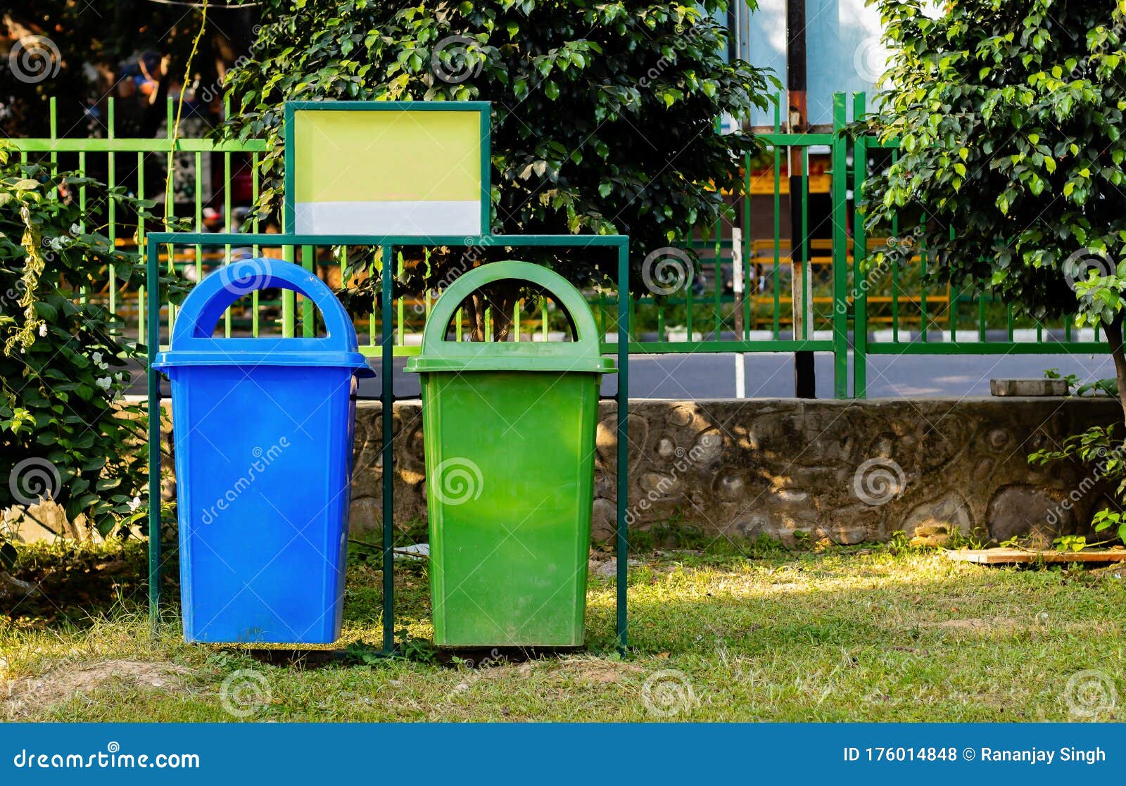 paper and plastic recycle bin placed in the garden for cleanness. cleanness concept