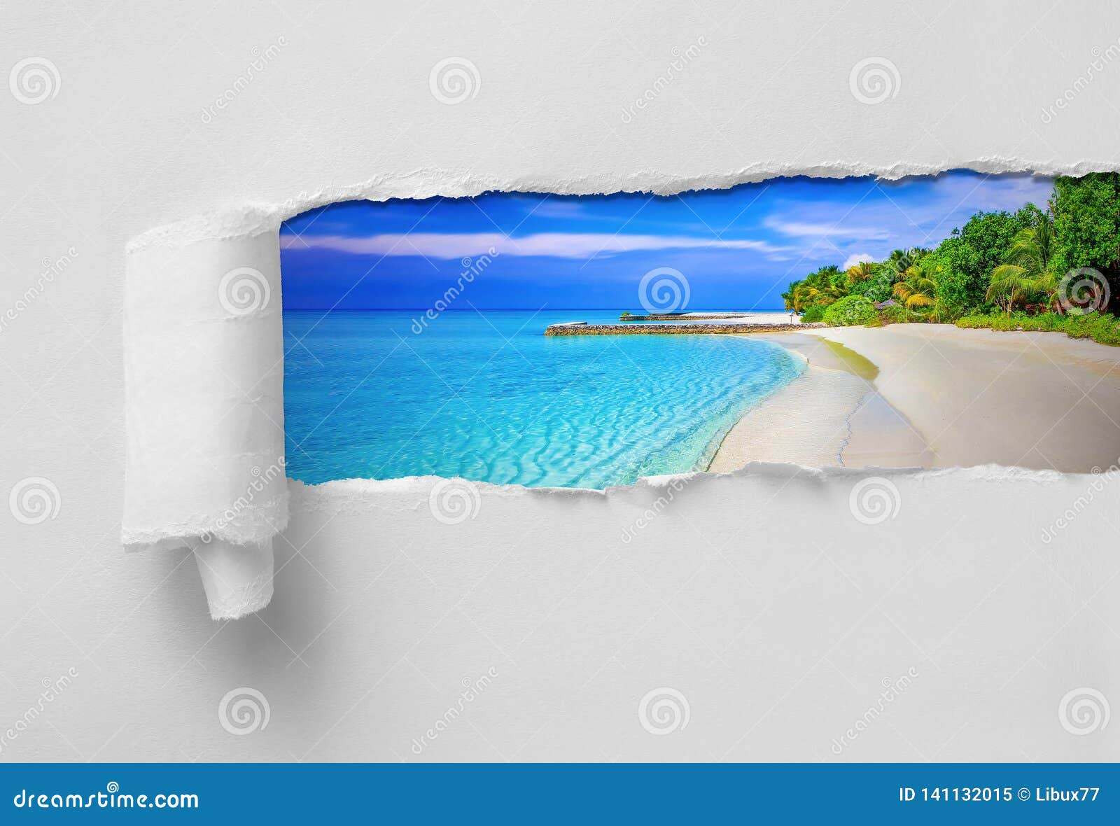 paper ripped revealing paradisiac tropical sea and beach