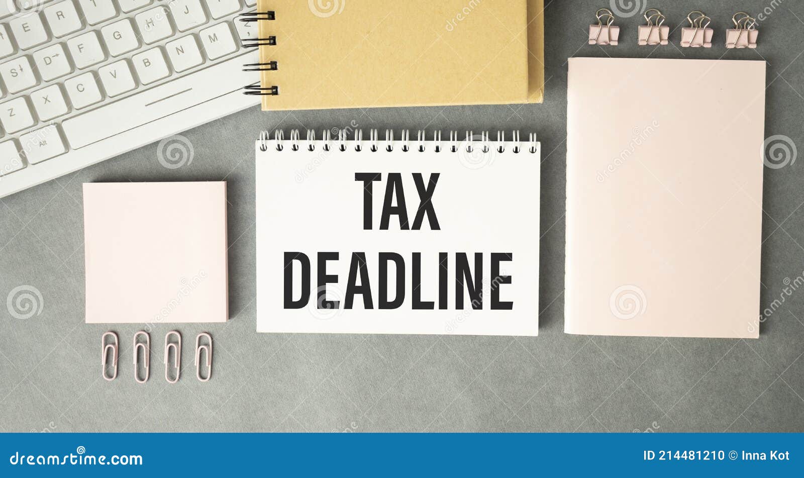paper sheet with text tax deadline, calculator