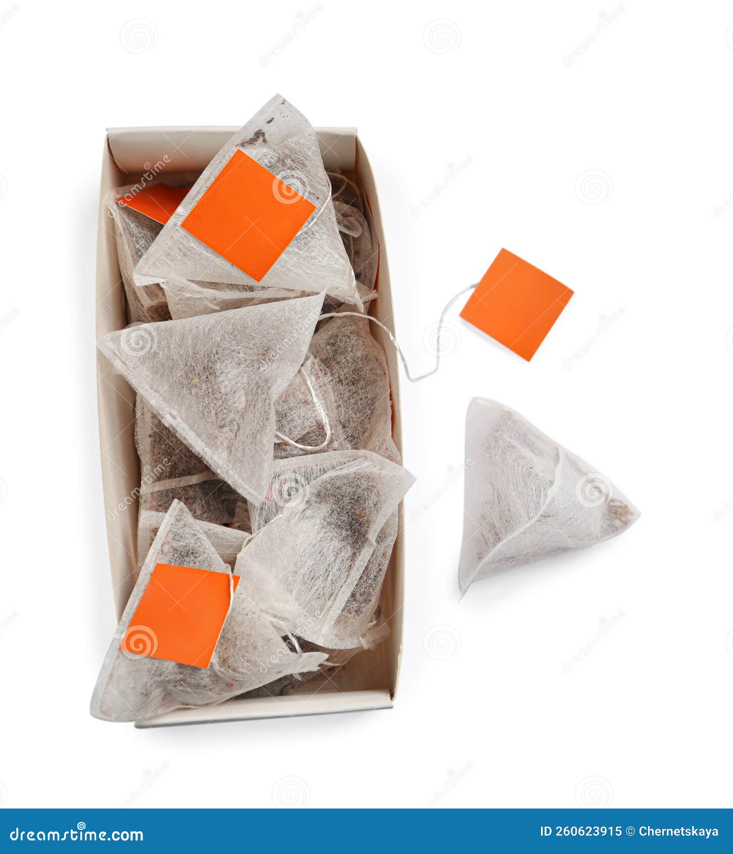 Paper Tea Bags with Tags and Box on White Background, Top View Stock