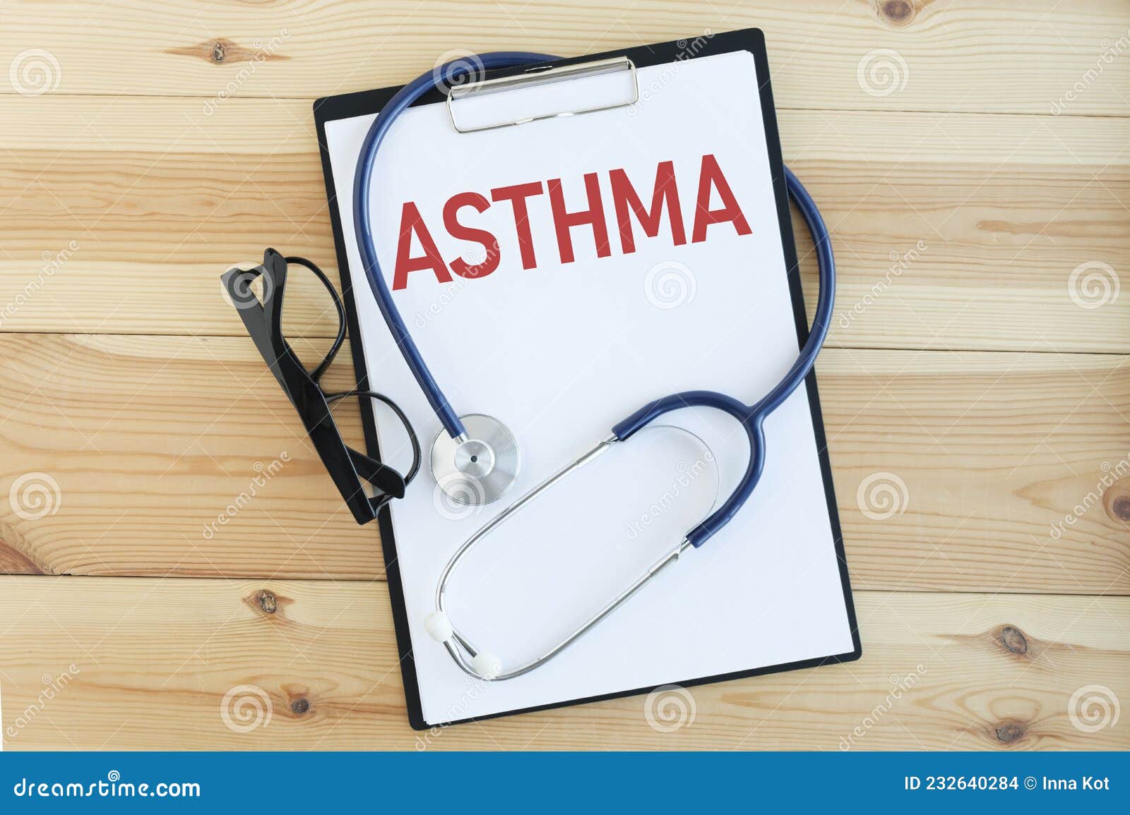 paper with text asthma on a table with stethoscope.