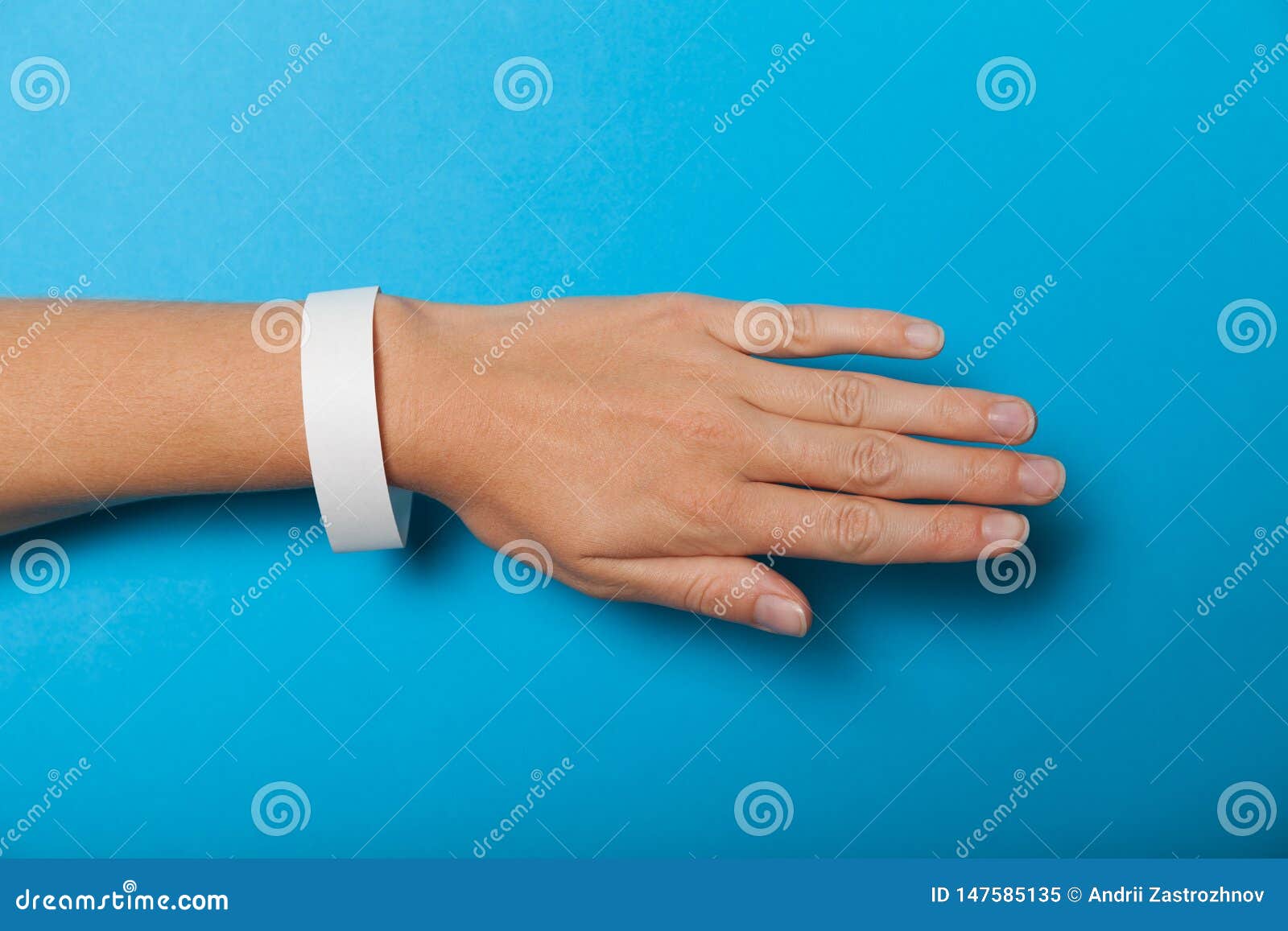 Paper Wristband Mockup, Event Bracelet On Hand. Empty Ticket Wrist Band
