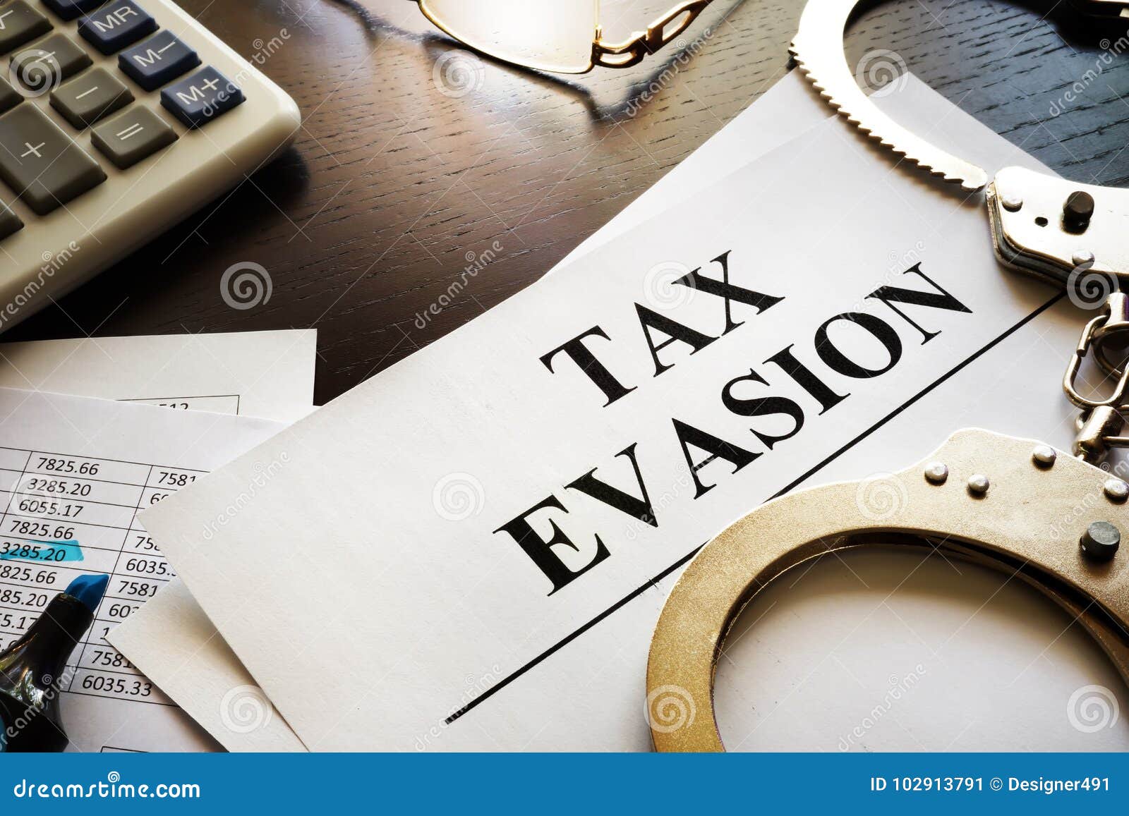 papers about tax evasion on a desk.