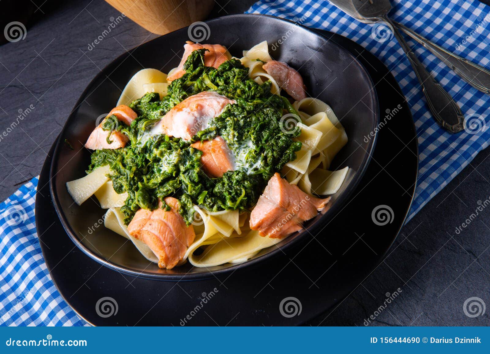 Pappardelle Pasta with Creamed Spinach and Fried Salmon Stock Photo