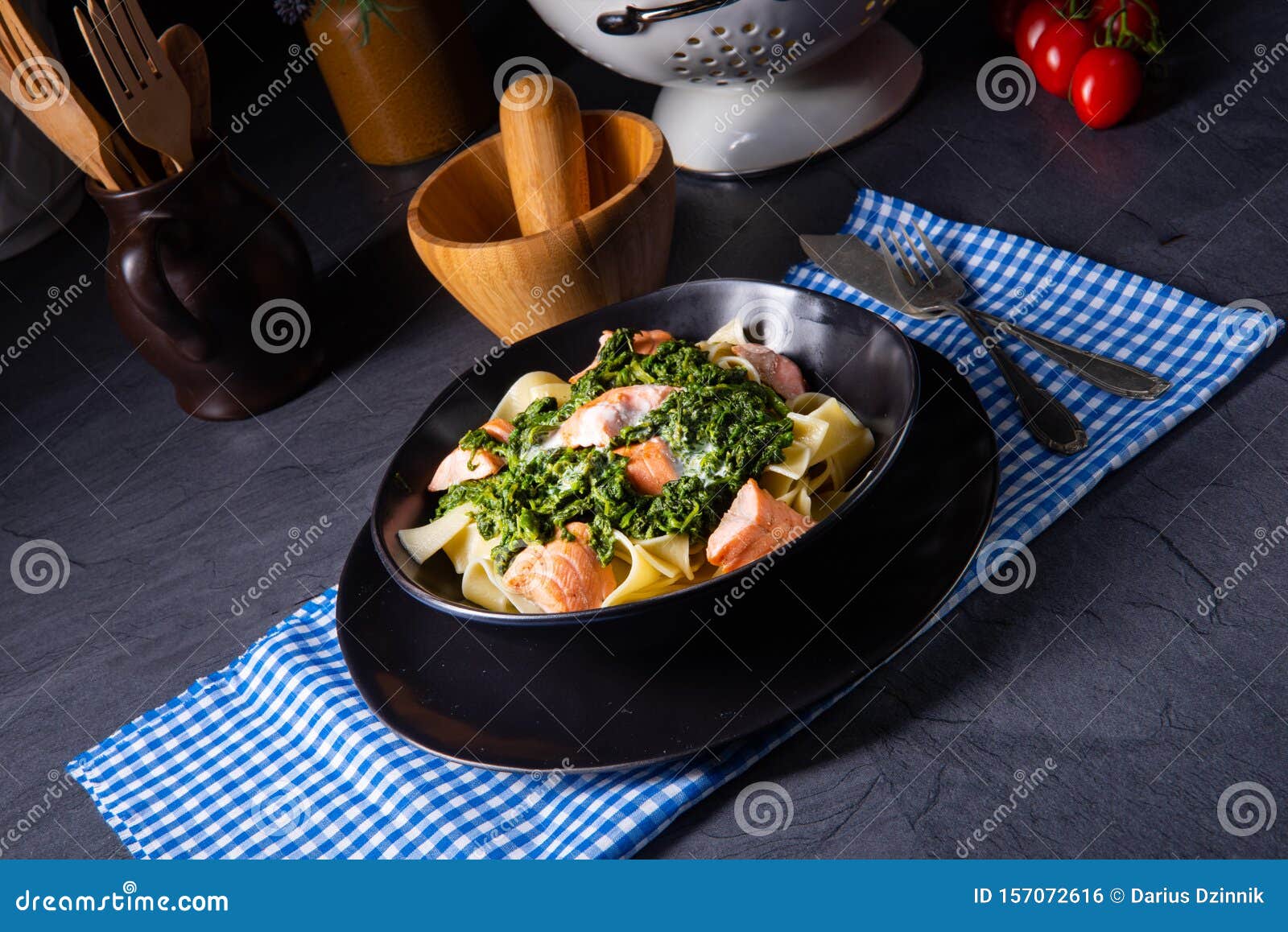 Pappardelle Pasta with Creamed Spinach and Fried Salmon Stock Photo