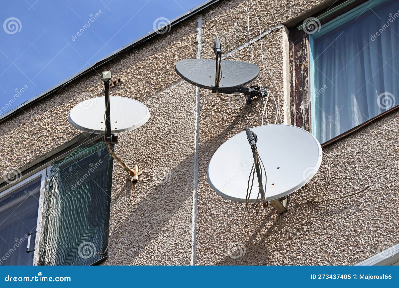 Parabolic Antennas on the Wall of an Apartment Building Stock Image