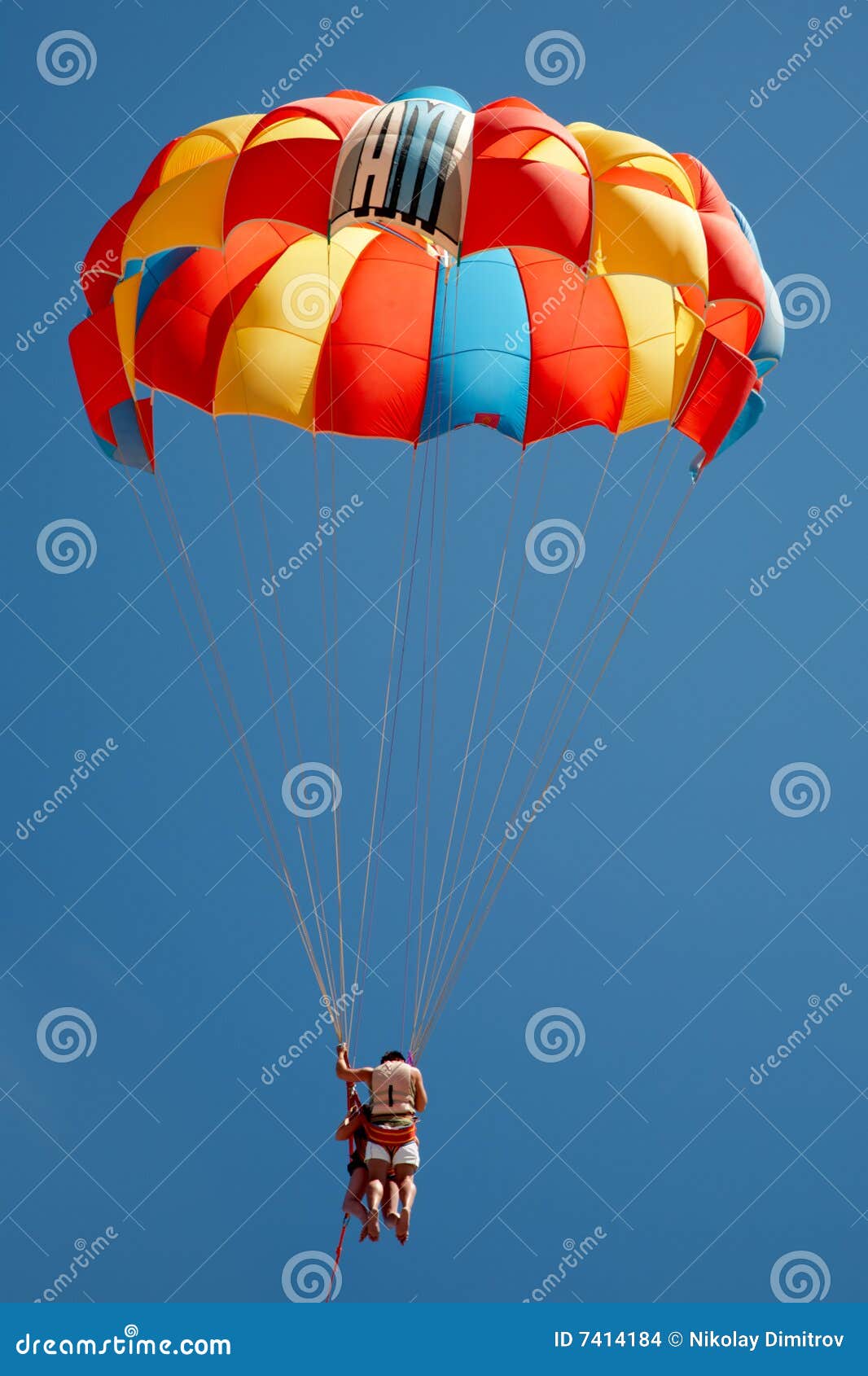 Parachute with a Couple Flying Stock Photo Image of beach