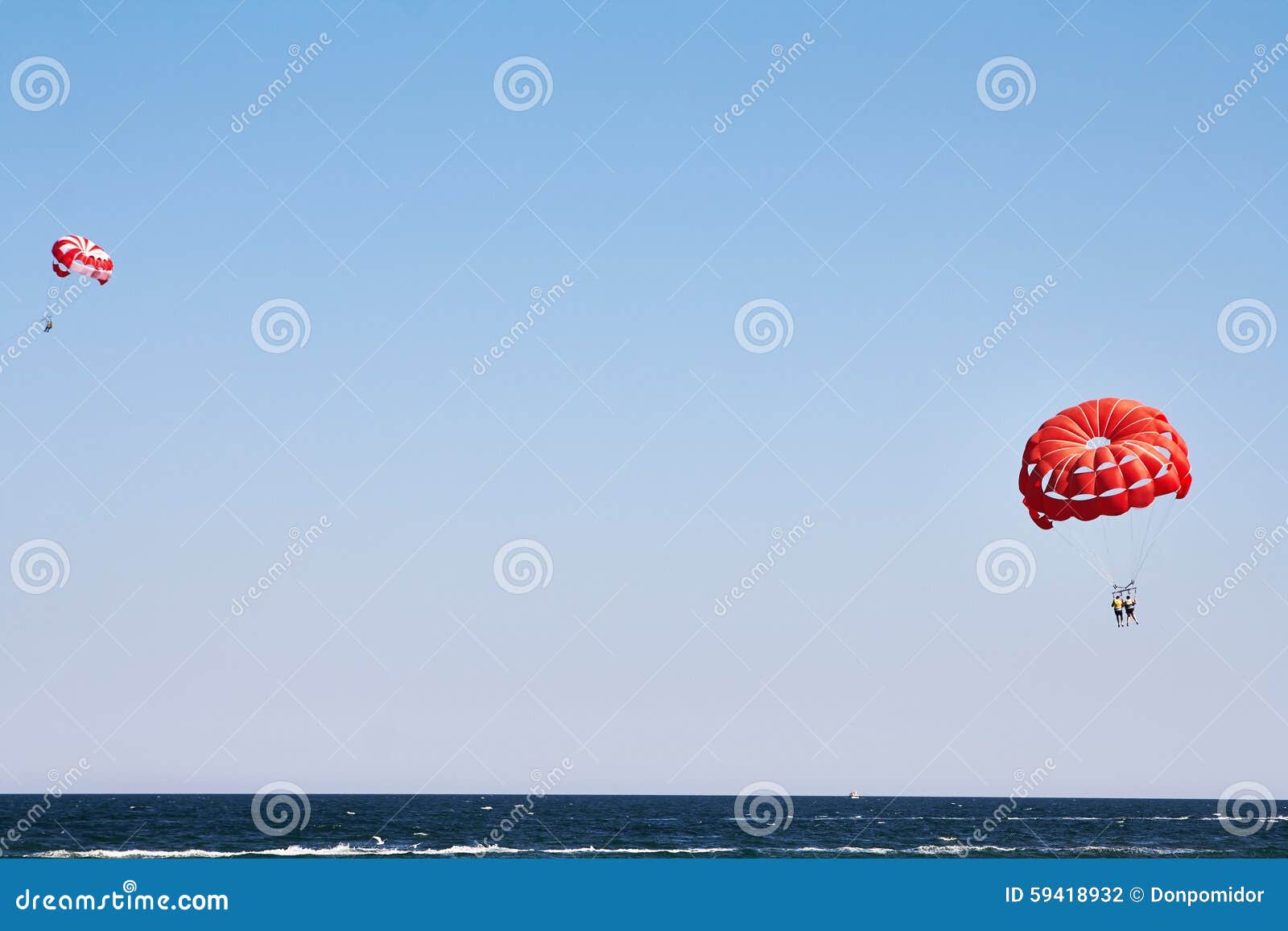 Parachuting at sea stock photo. Image of holiday, height 59418932