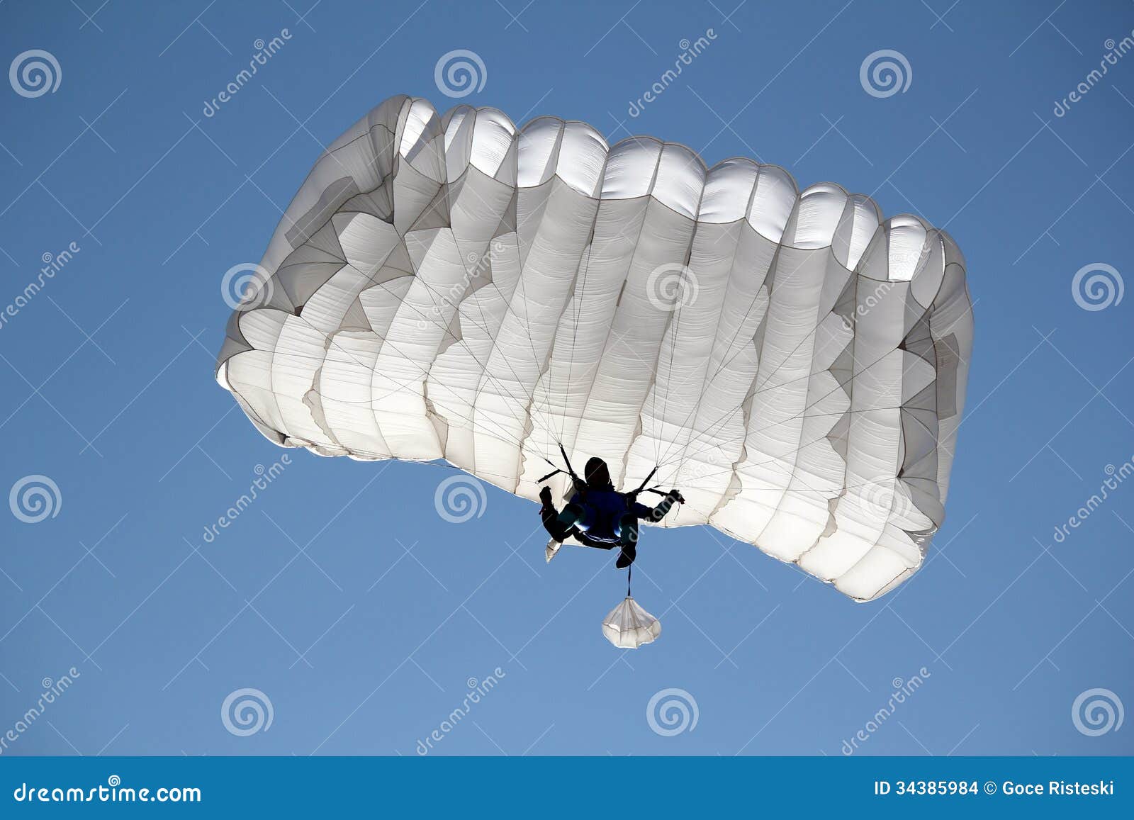 parachutist on blue sky