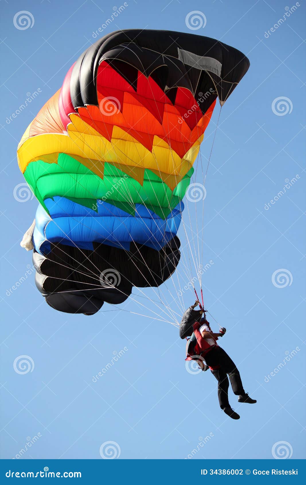 parachutist with colorful parachute