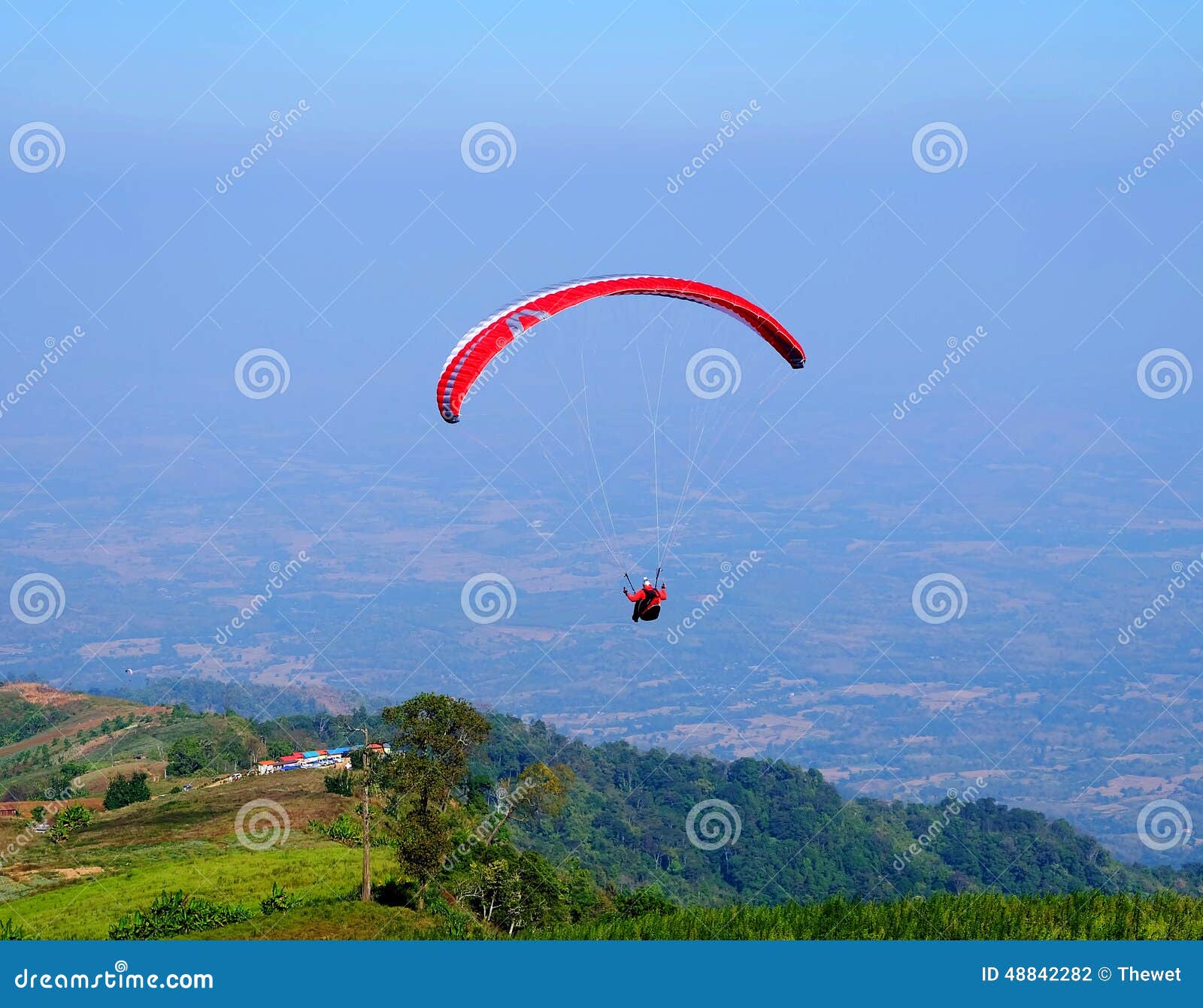 Parachutist with a Red Parachute Stock Photo Image of leisure