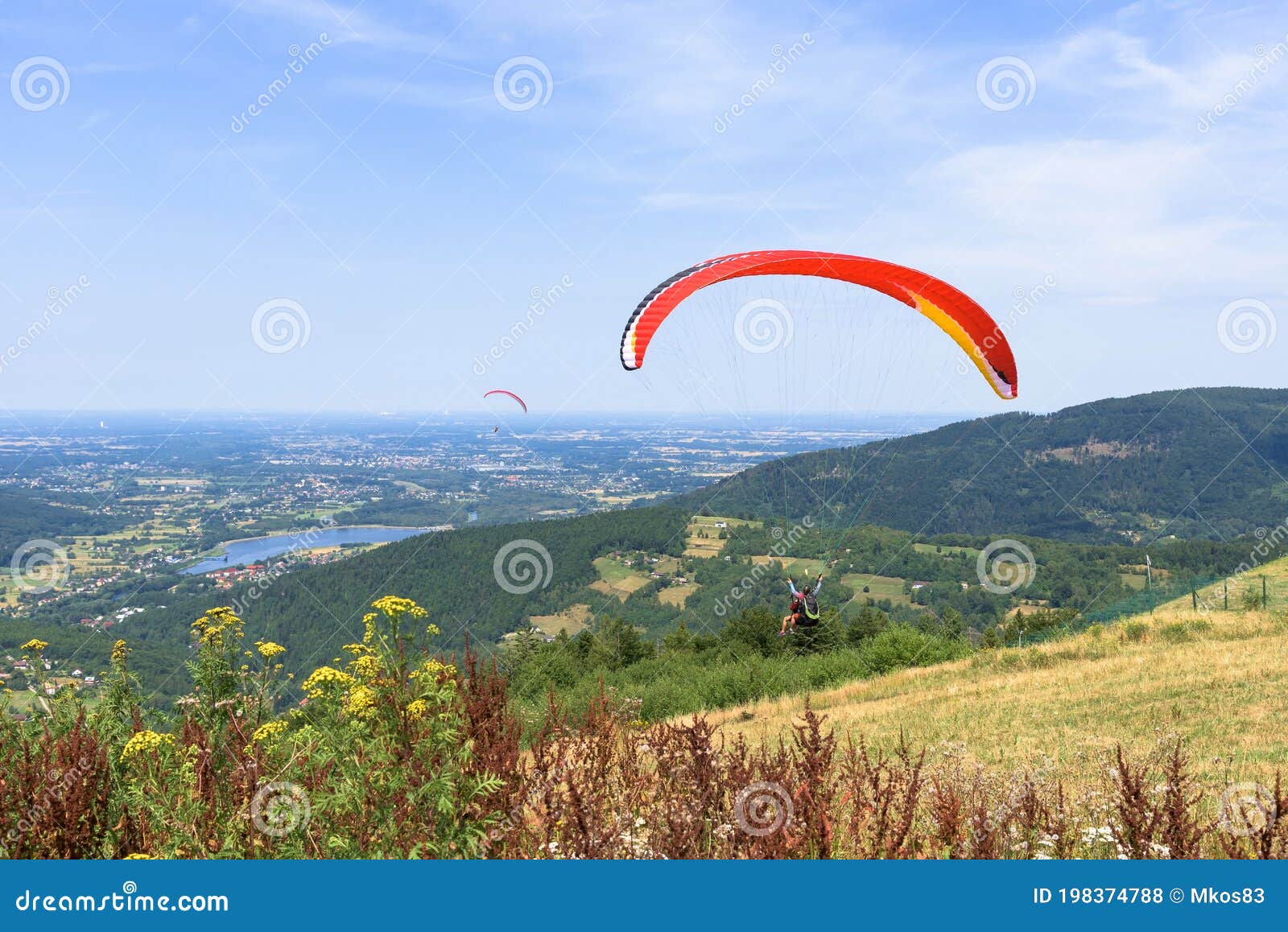 paragliders start their flight on zar mountain in poland