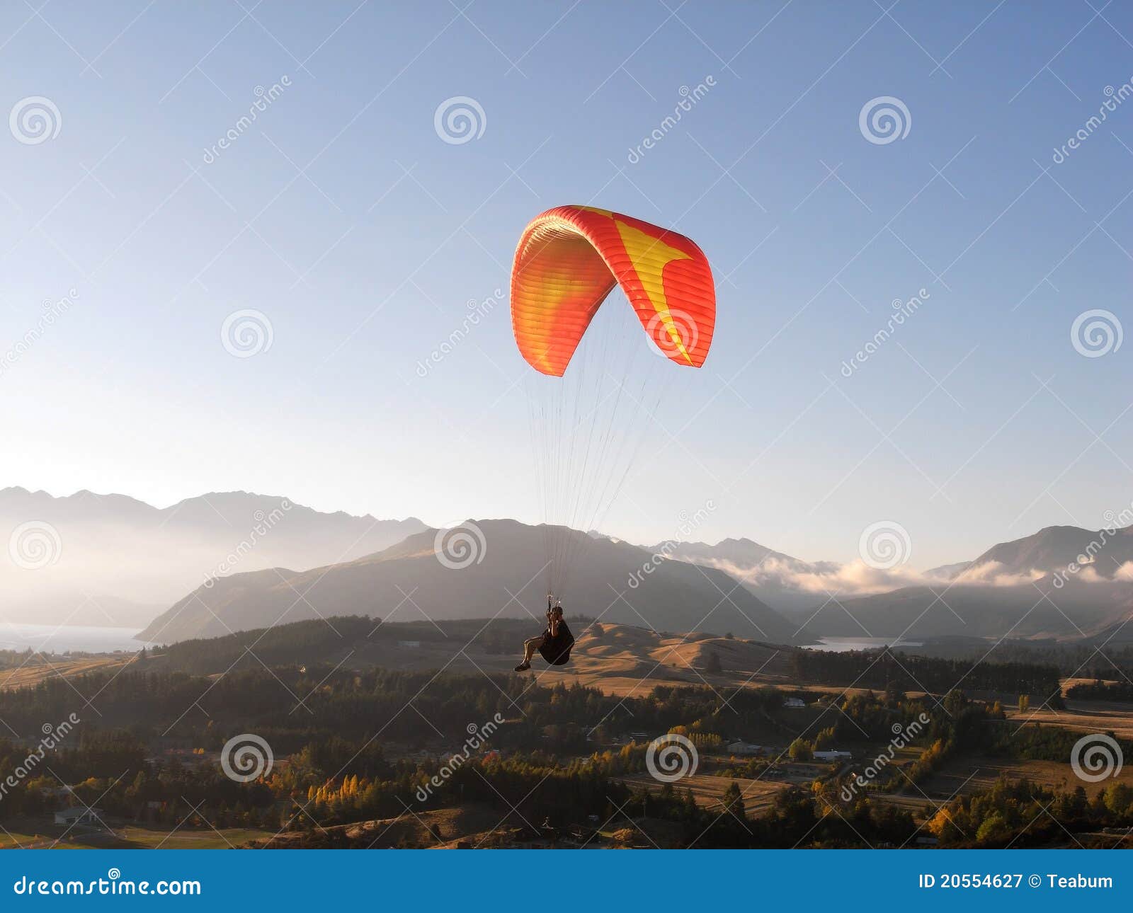 paragliding above mountain scenery
