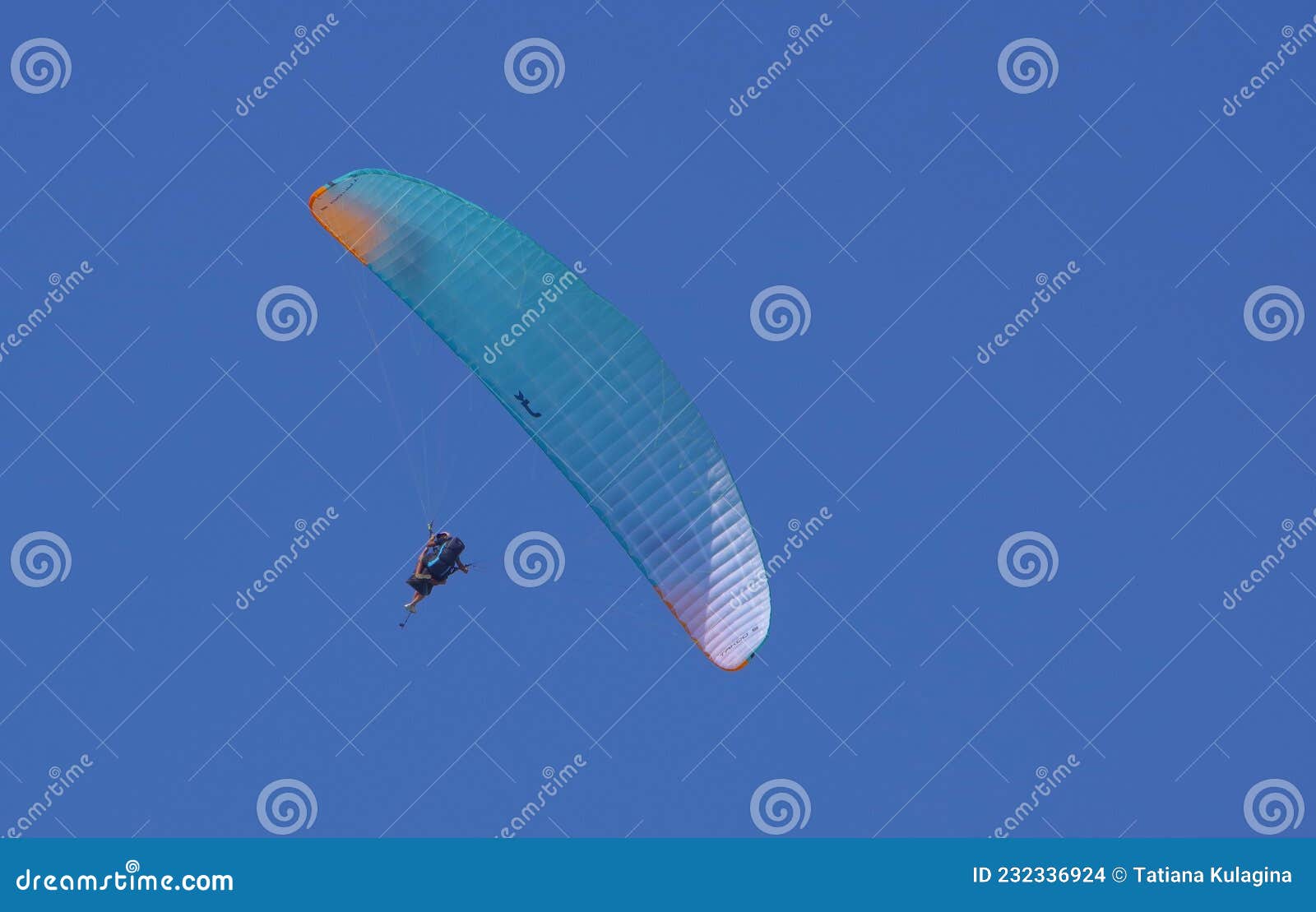 paragliding against the blue sky