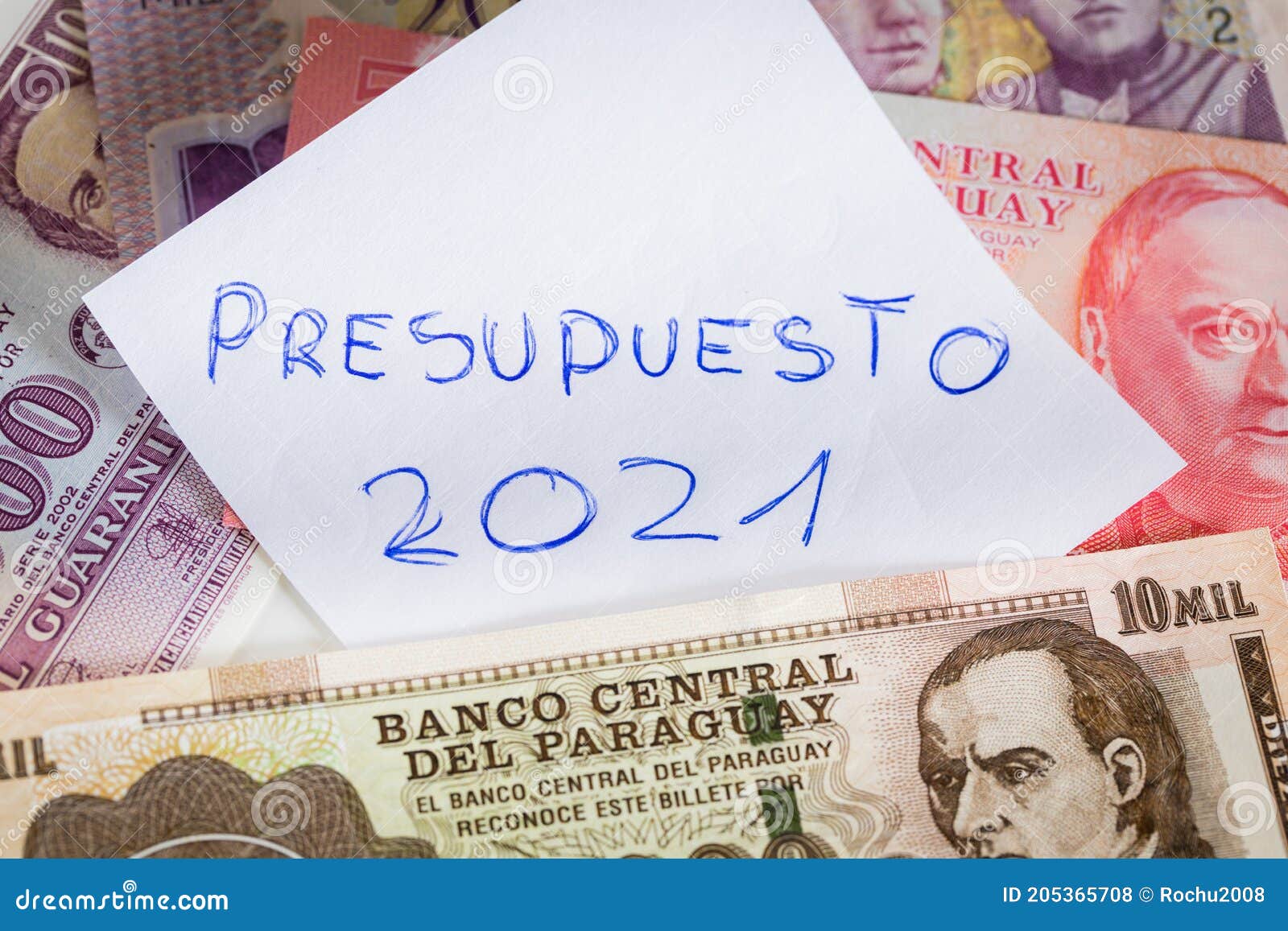 paraguay money. a handwritten inscription on a sheet of paper in spanish