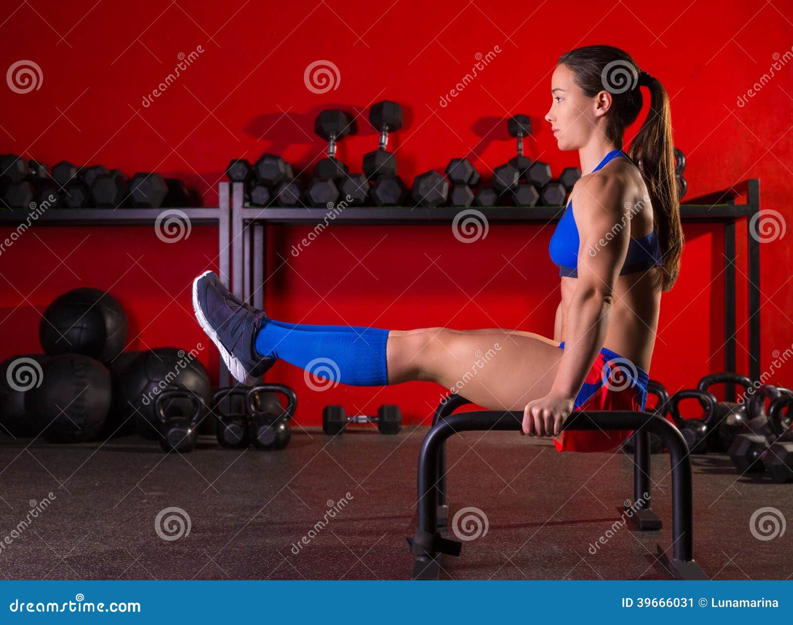 parallettes woman parallel bars workout at gym