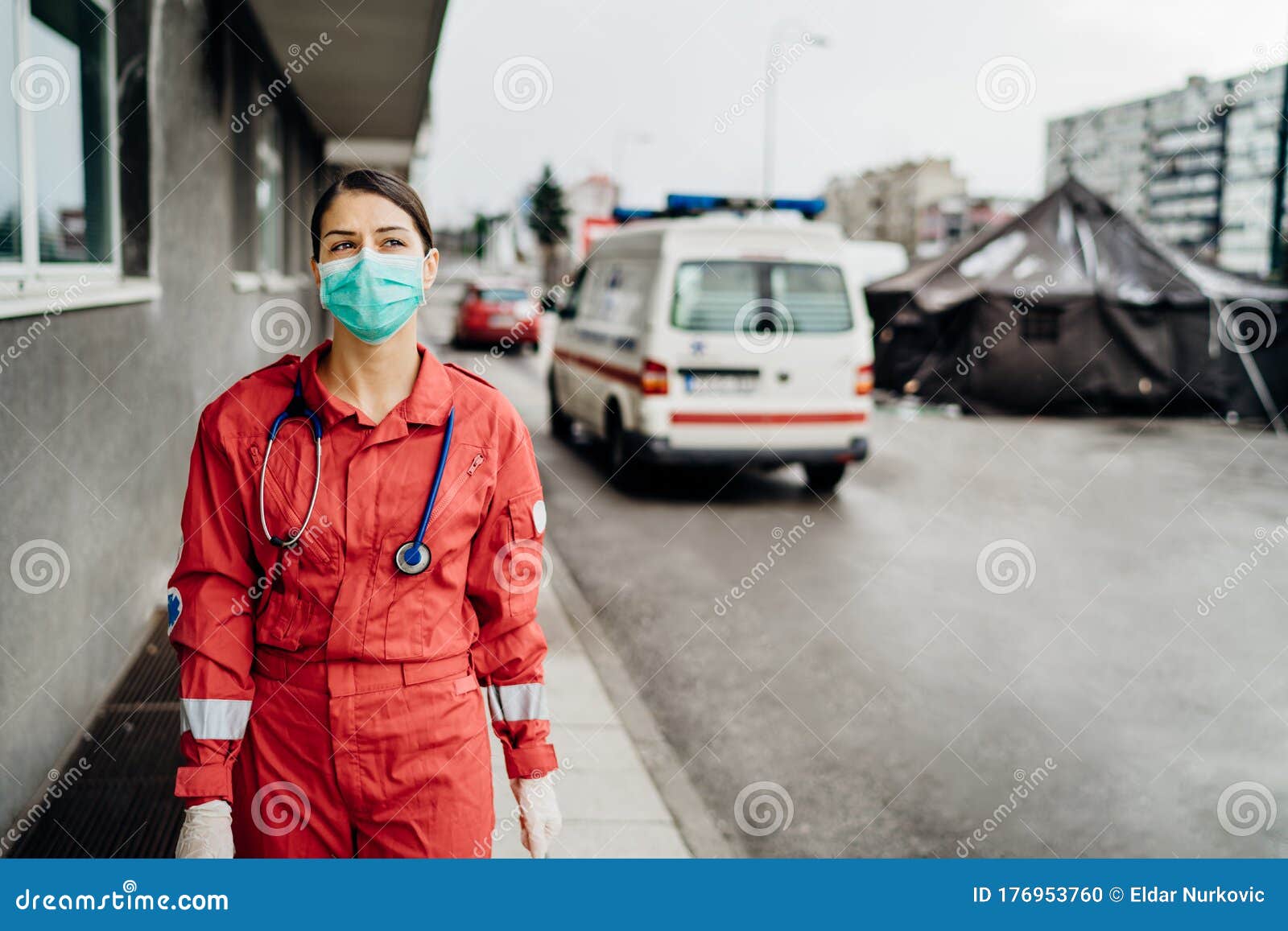 paramedic in front of isolation hospital facility.coronavirus covid-19 heroes.mental strength of medical professional.emergency