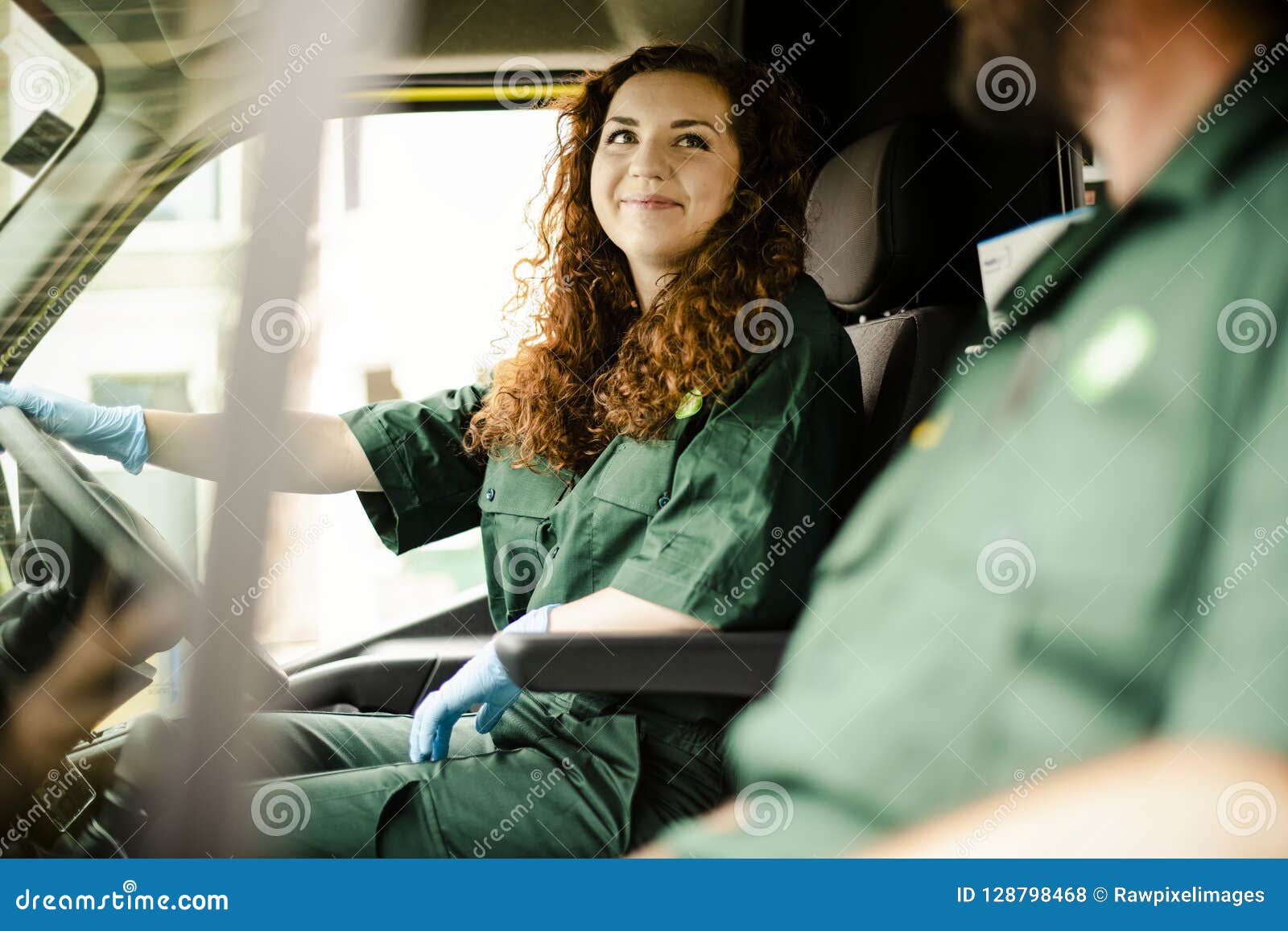 paramedic woman driving an ambulance