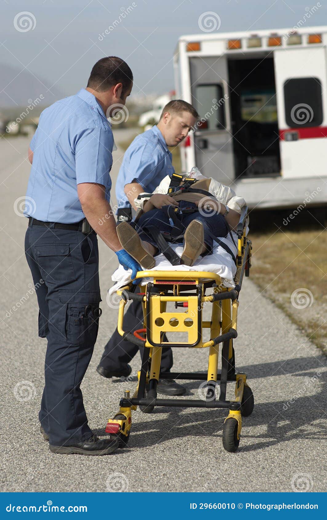 paramedics carrying victim on stretcher