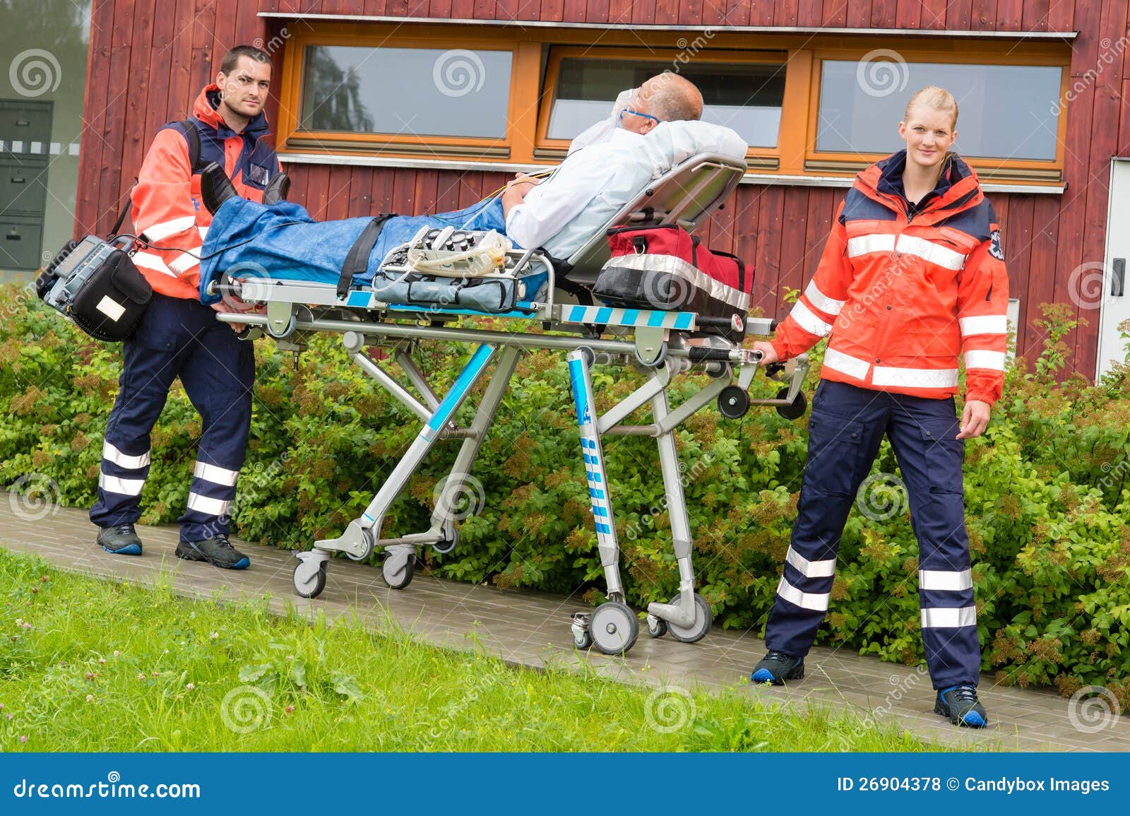 Paramedics With Patient On Stretcher Ambulance Aid Royalty Free Stock