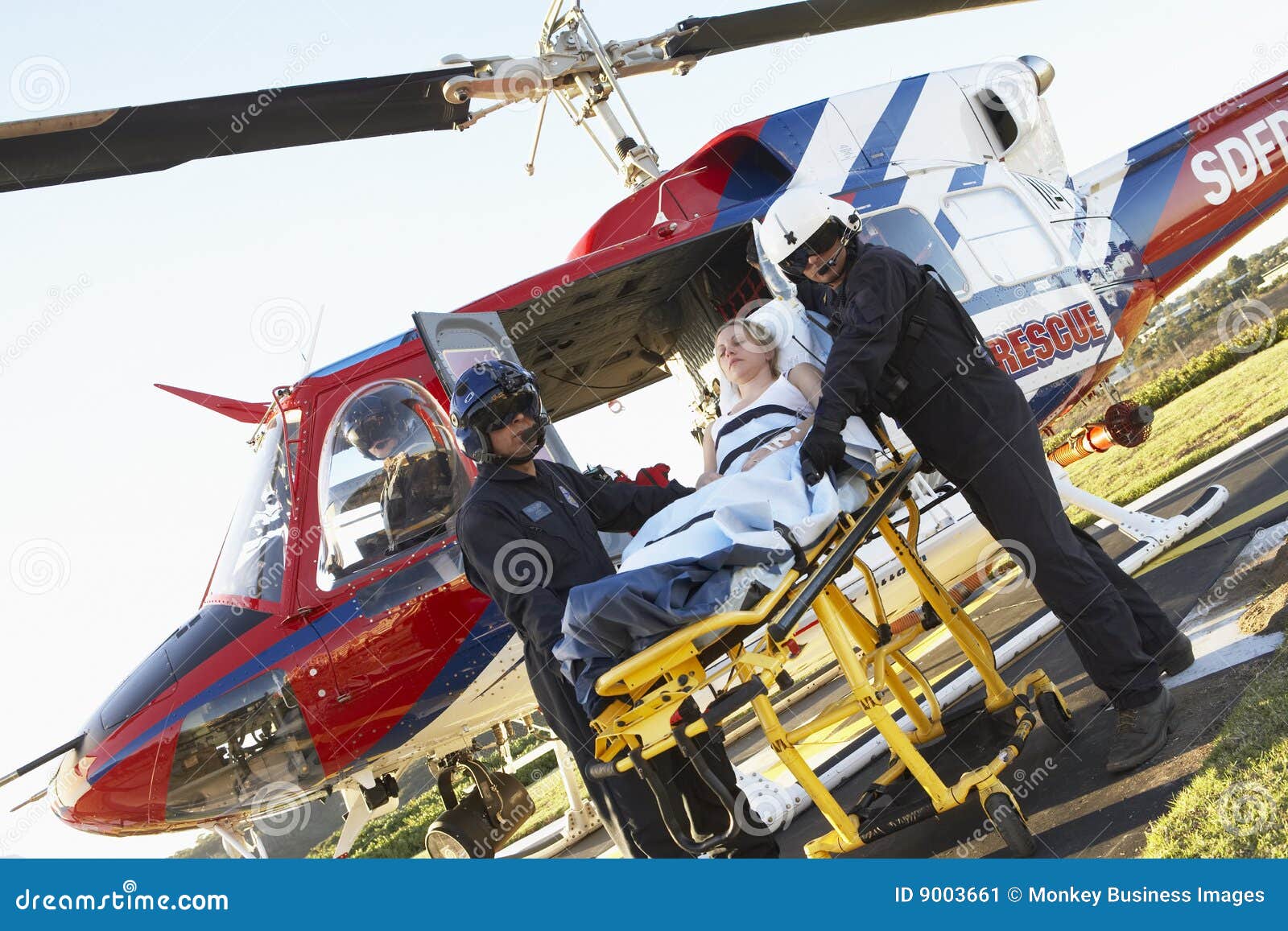 Paramedics Unloading Patient from Helicopter Stock Image Image of